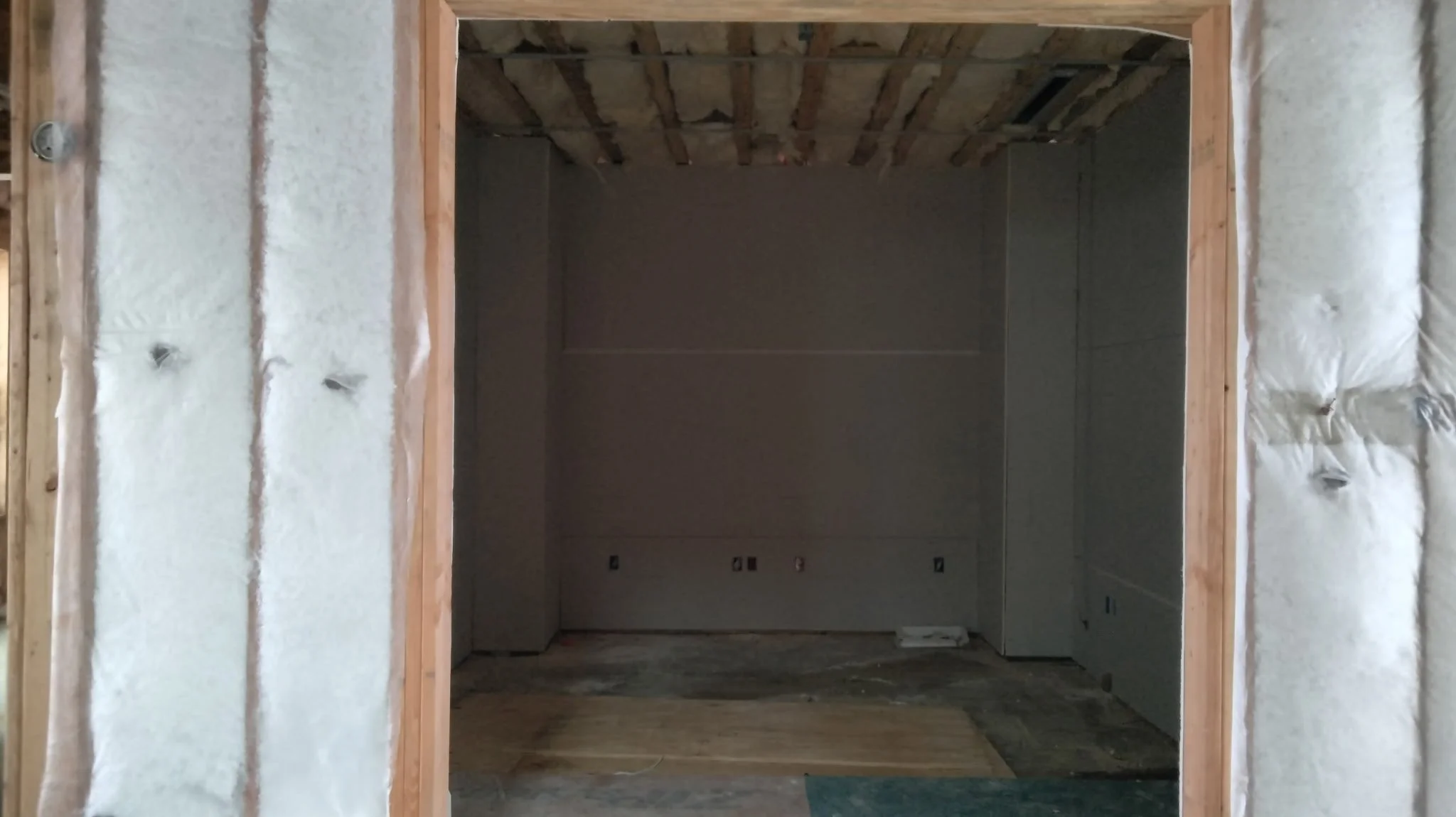 Media room framed and insulated during pre-wire, before drywall