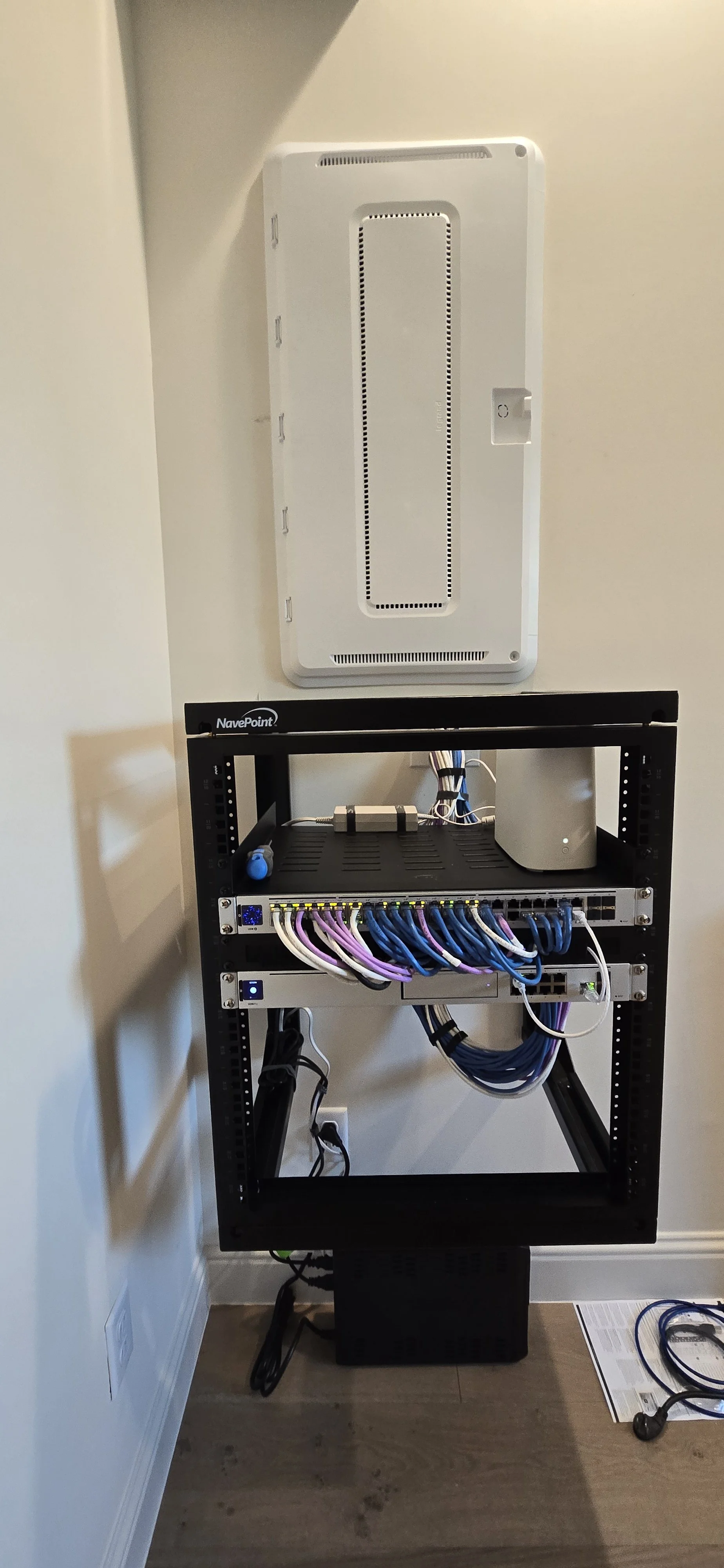 Finished, wired network rack in a utility closet