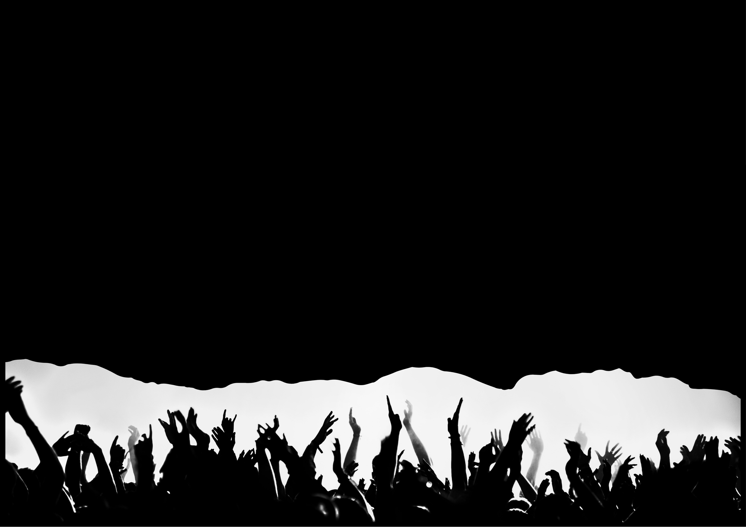 Silhouettes of a live music crowd with raised hands