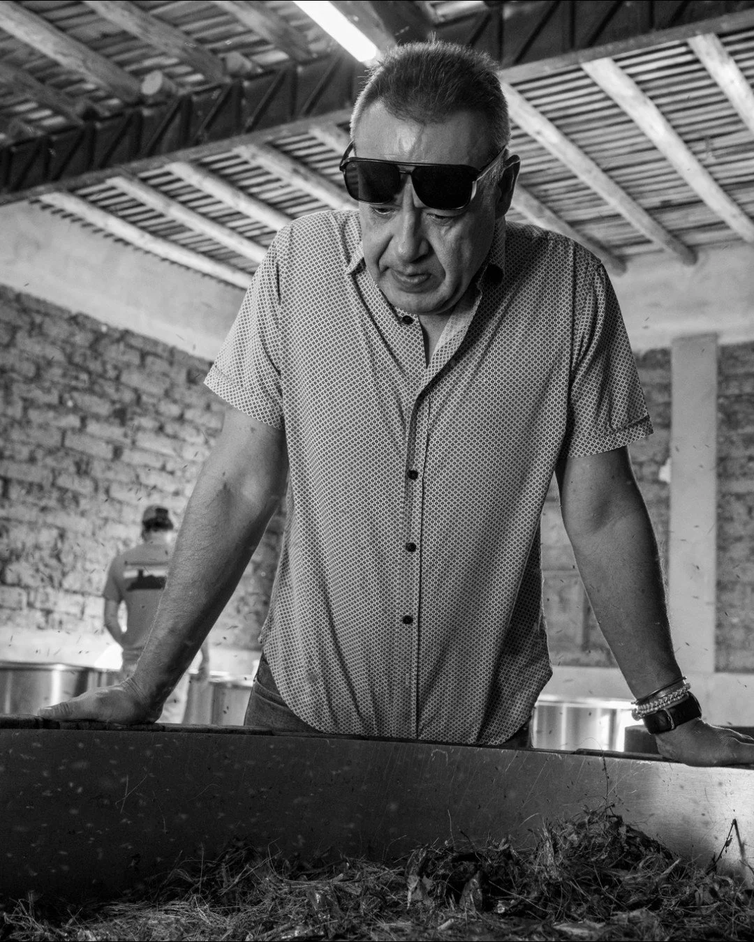 At Casa Ruelas, fermentation is a living process shaped by wild yeast, experience and the natural environment.

Victor, one of our partners, is checking a fermentation vat where bagazo, the sugar-rich fibers from shredded, cooked sotol, have risen to