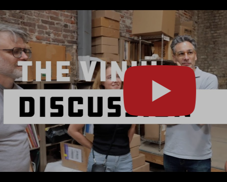 Members of the Cinyl Record Manufacturers stand together in a vinyl pressing facility.
