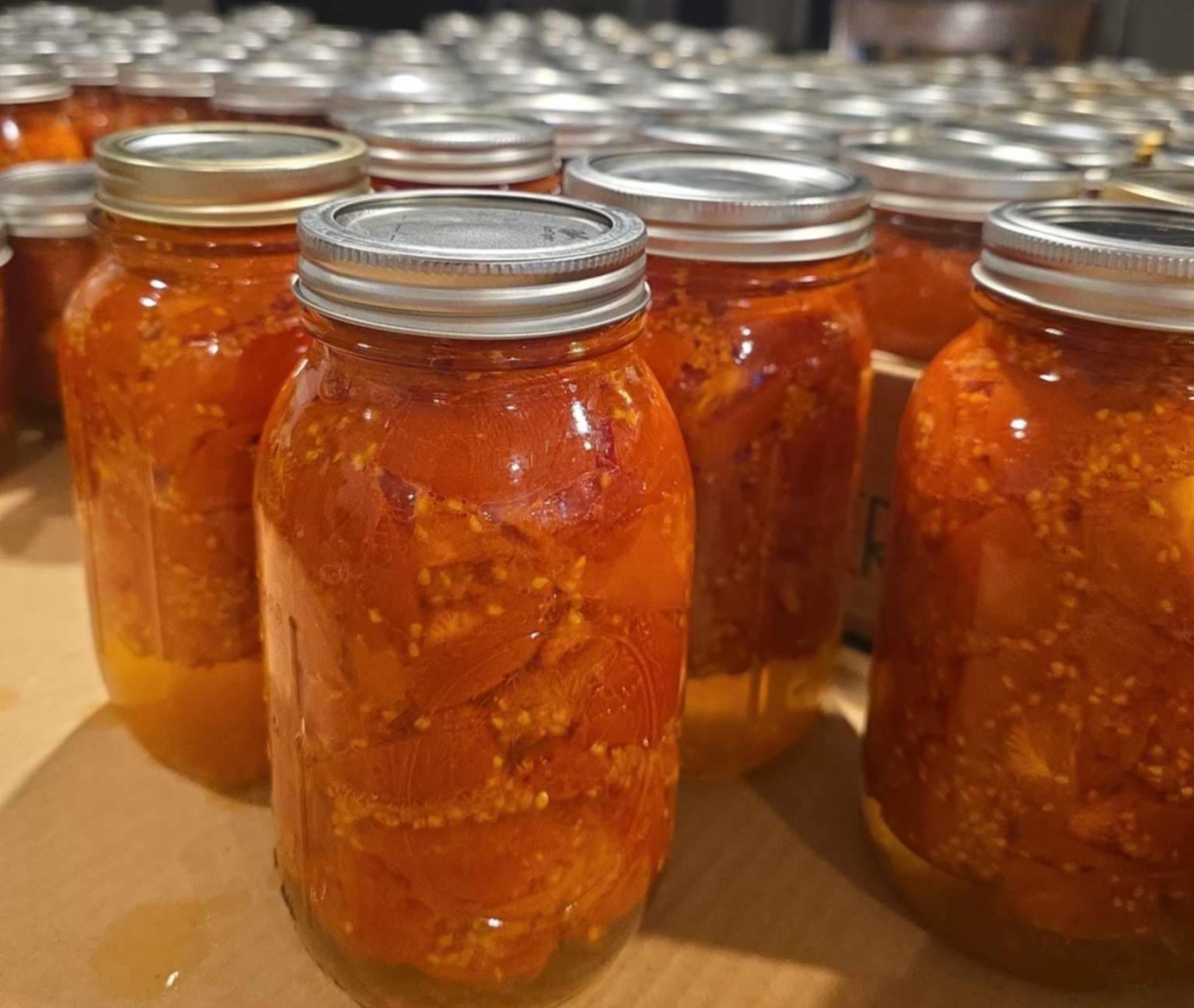Tomatoes in canning jars.