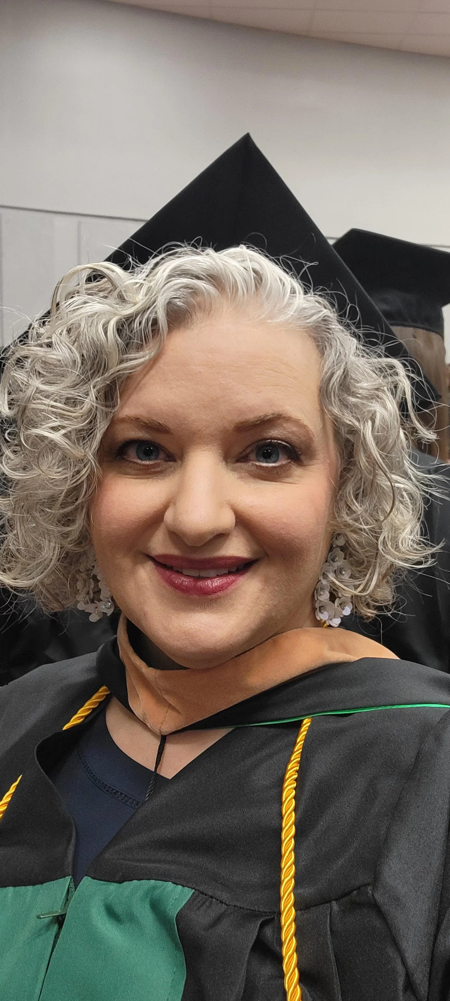 Hilari graduating from UNT with her MBA.