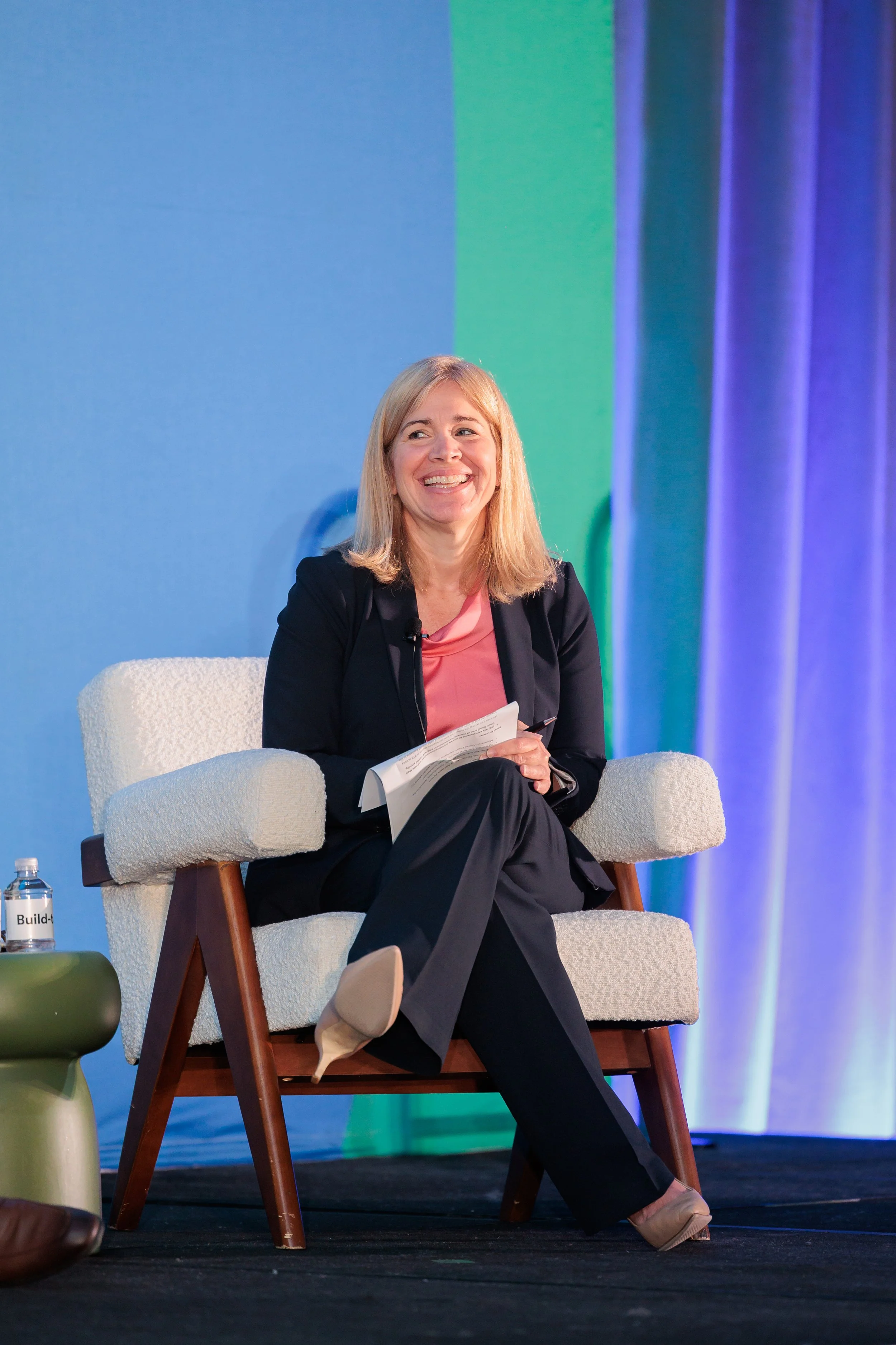 Whelan Advisory team member, Andrea Finger, on stage. 