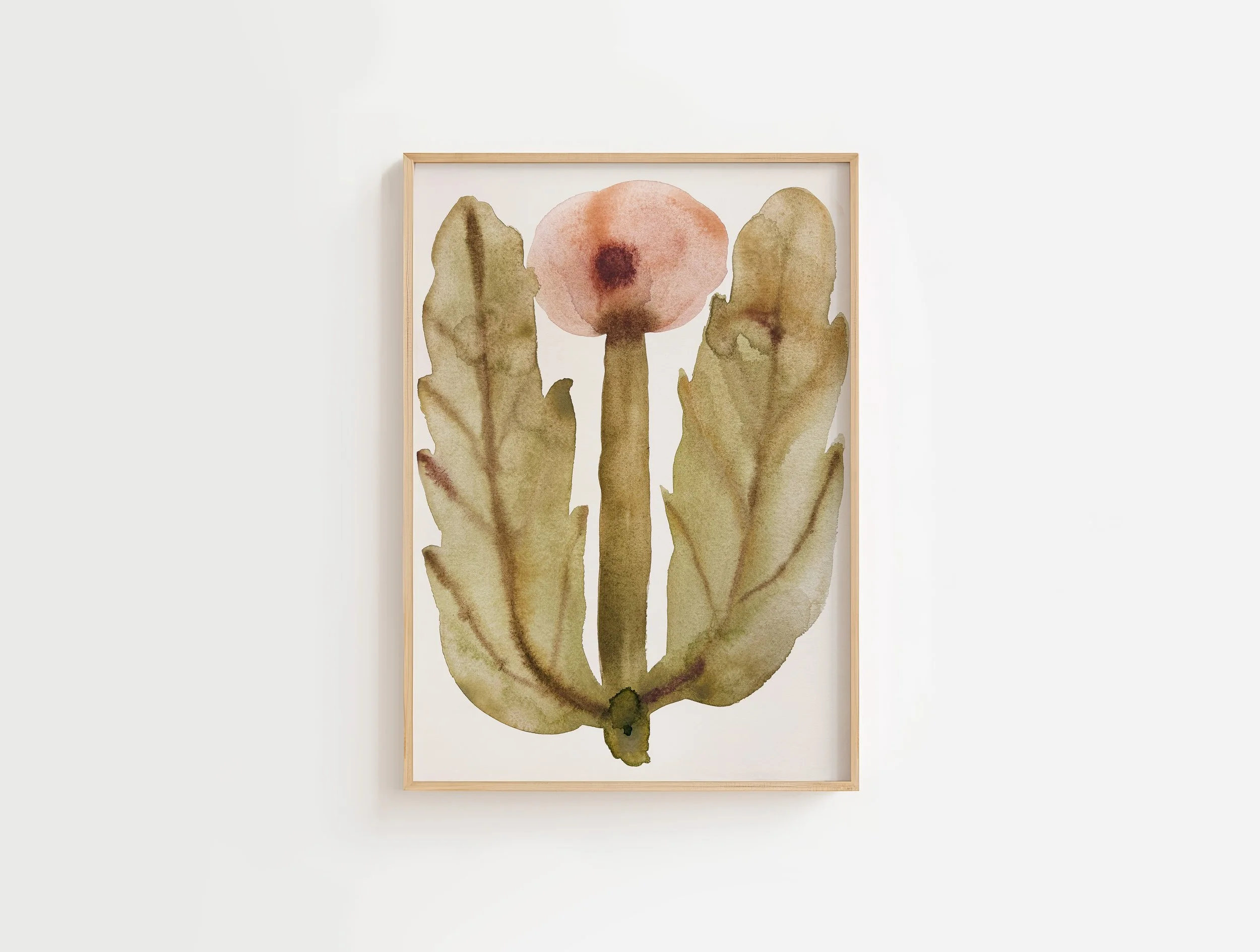 Watercolor painting of a cactus plant with a pink flower at the top, framed in light wood, hanging on a plain white wall.