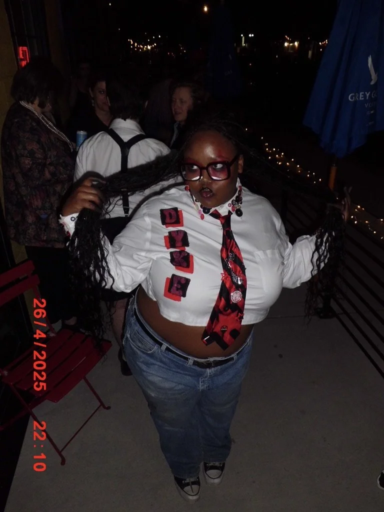 Clarise @hard2swallowzine wearing a cuatom button-up and tie.