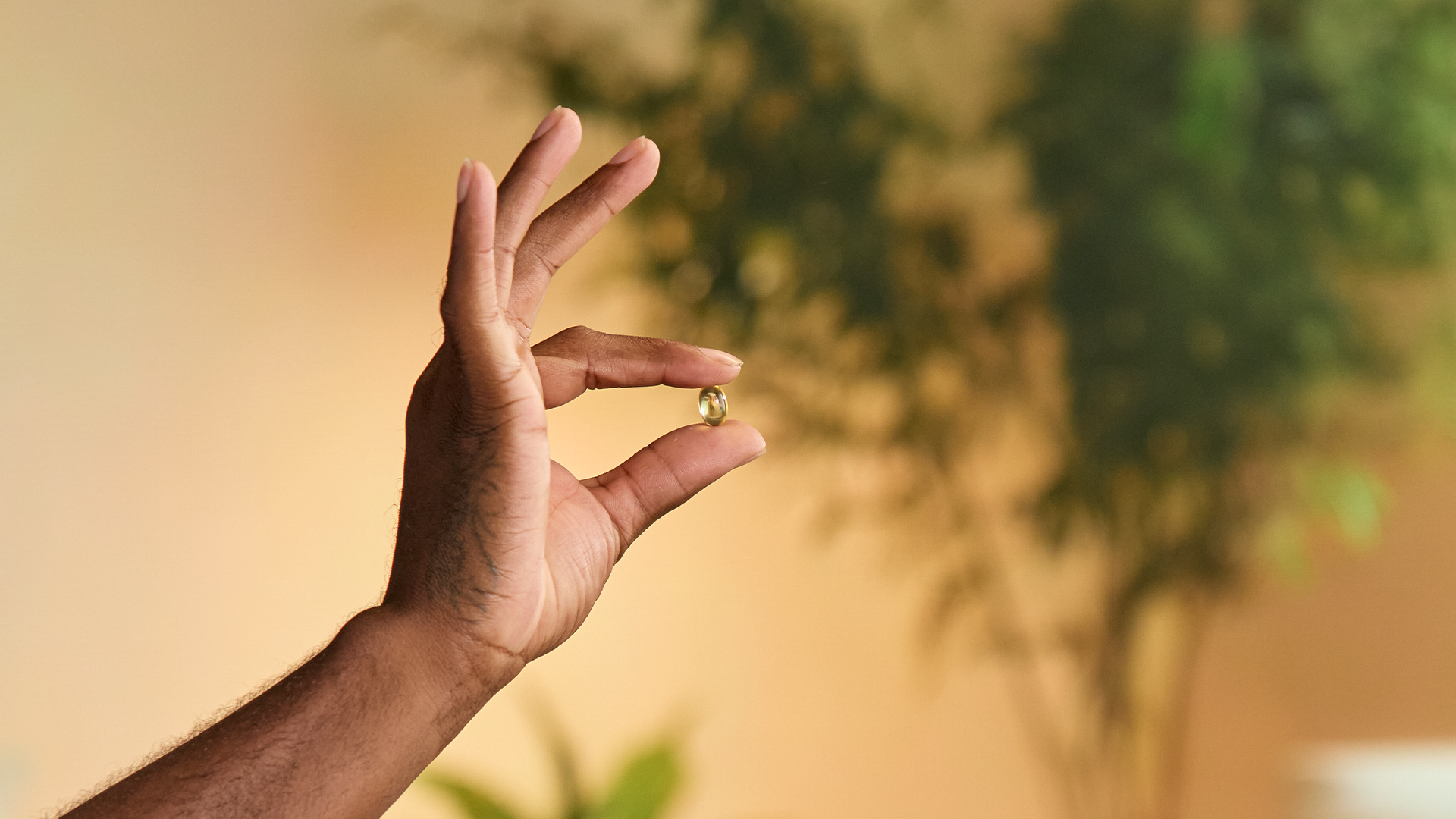 Man holding Omega 3 2.png