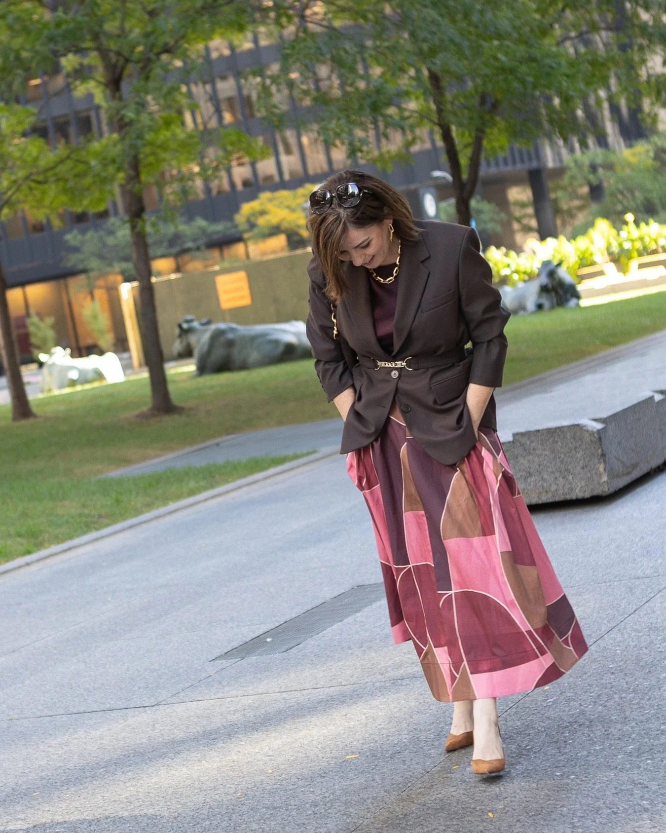 Love your flowy skirts but think they are too casual for office attire? Try topping them with a structured blazer. The tailoring up top grounds the outfit and signals professionalism, while the skirt brings colour, pattern and maybe even a little whi