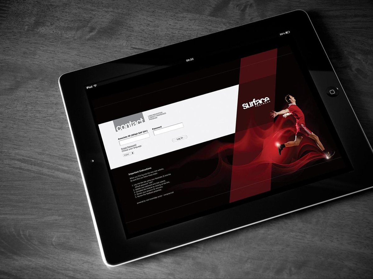 Tablet displaying a login page with a contact form and a graphic of a person in motion, wearing red sportswear, on a wood table.