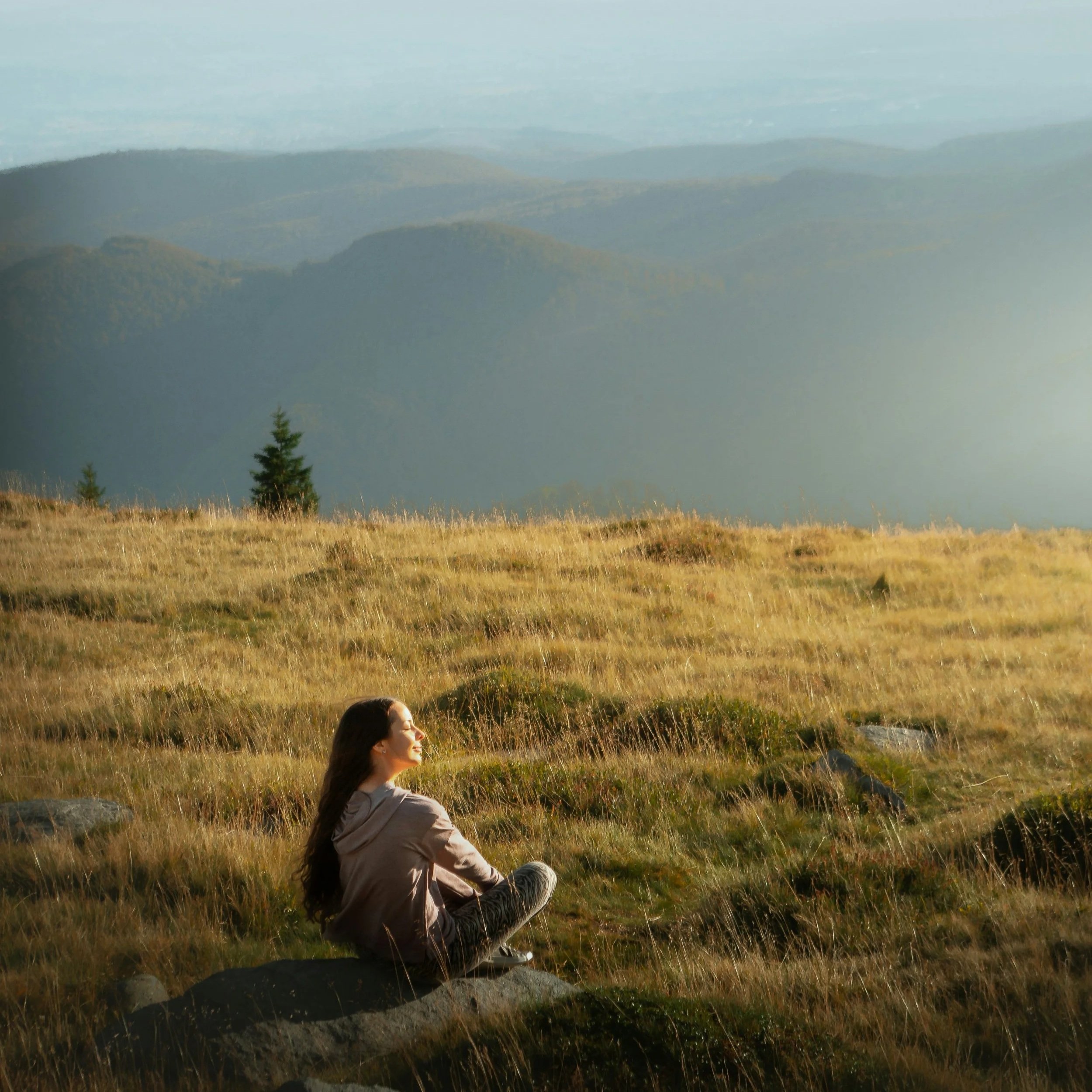 Woman sitting in field