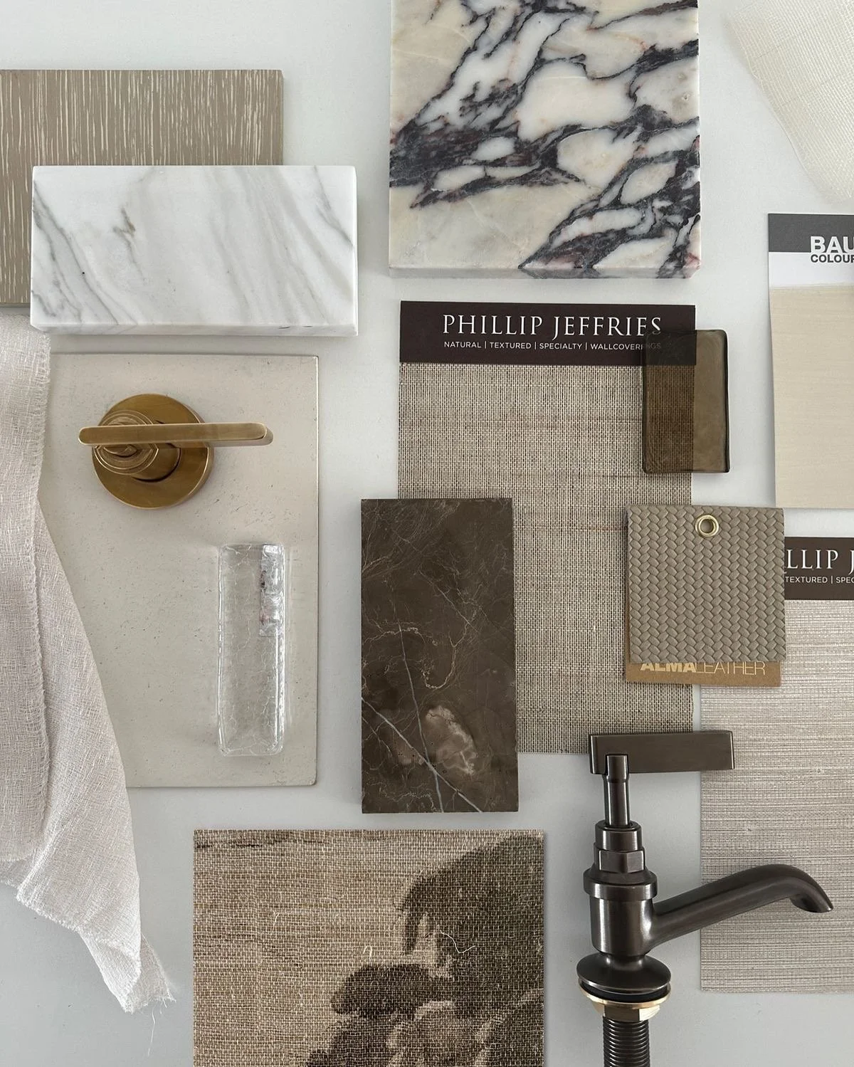 Neutral luxury interior design mood board featuring textured fabrics, warm wood tones, marble, brass accents, smoked glass, and woven carpet swatches in a layered flat lay.