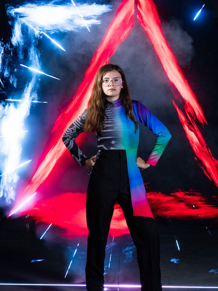 band student with laser light and fog