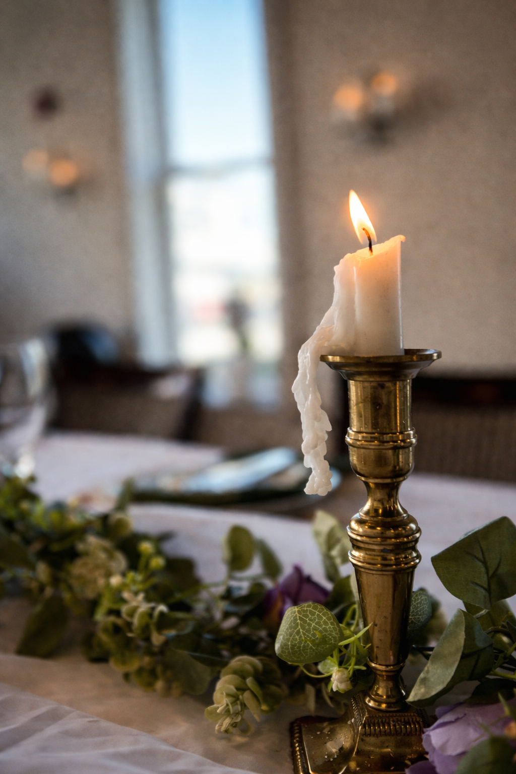 Flickering candle in soft daylight.png