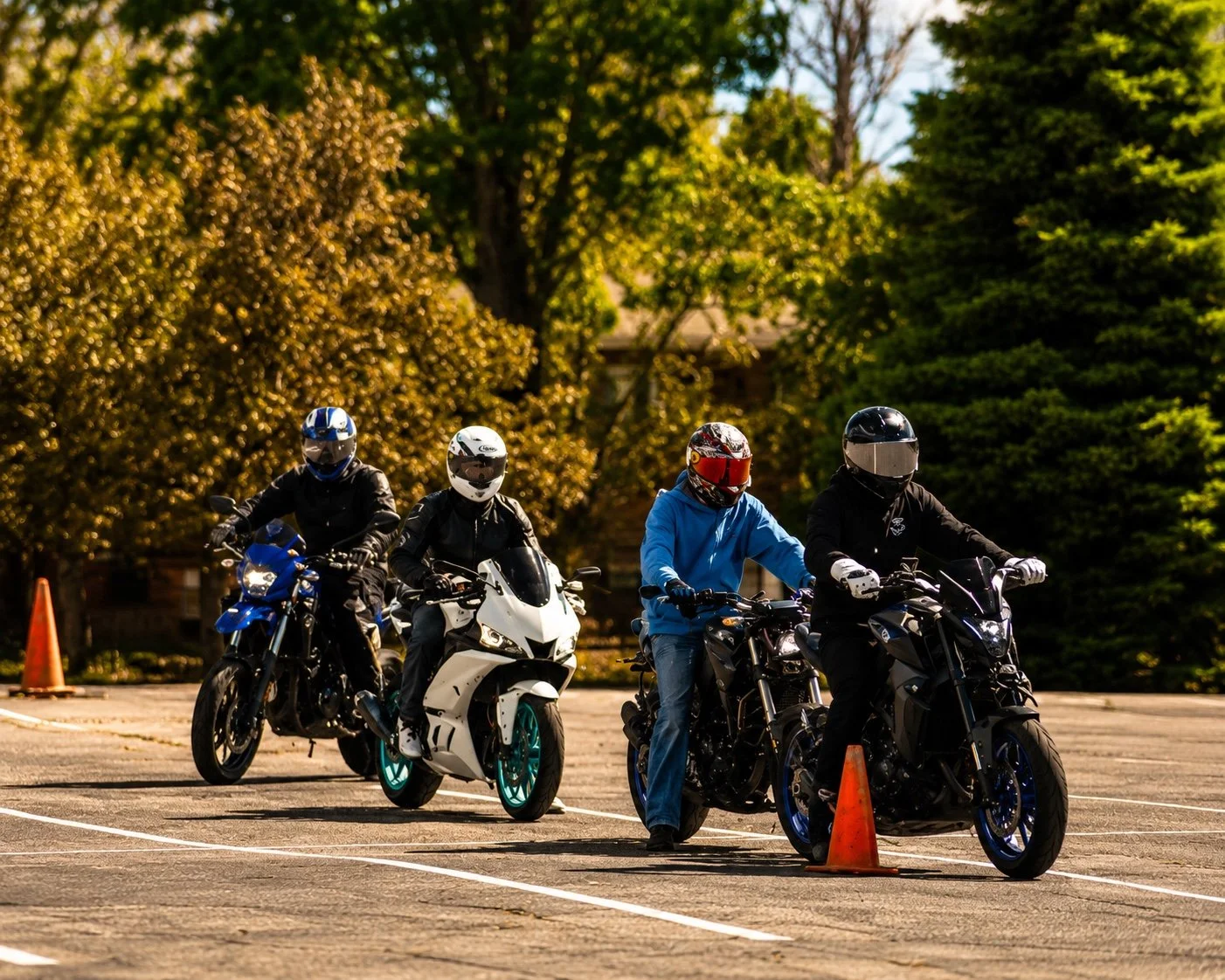 four experienced motorcycle riders training on the range