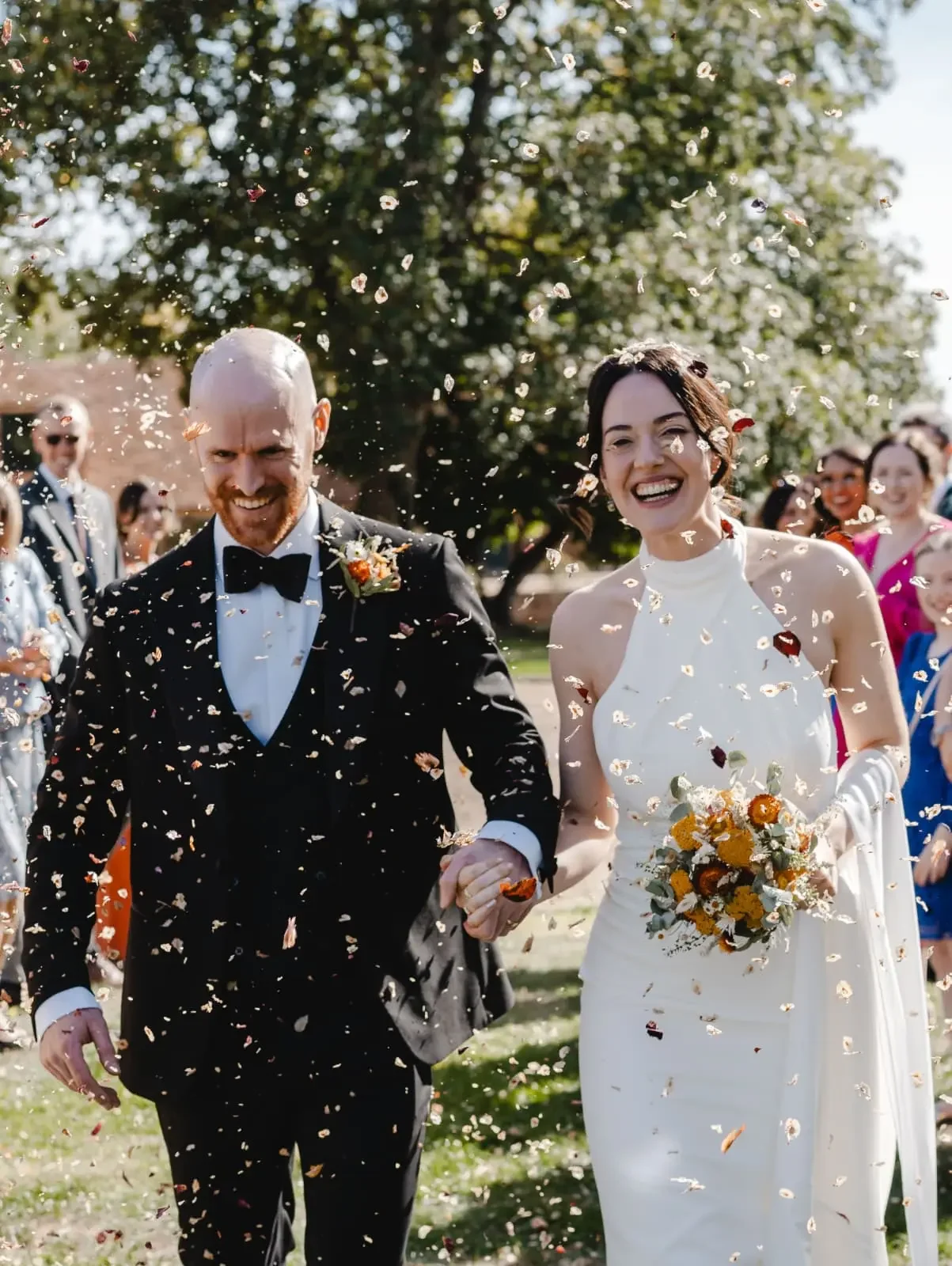 Bride and groom confetti floral eucalyptus strawflowers bridal bouquet.webp