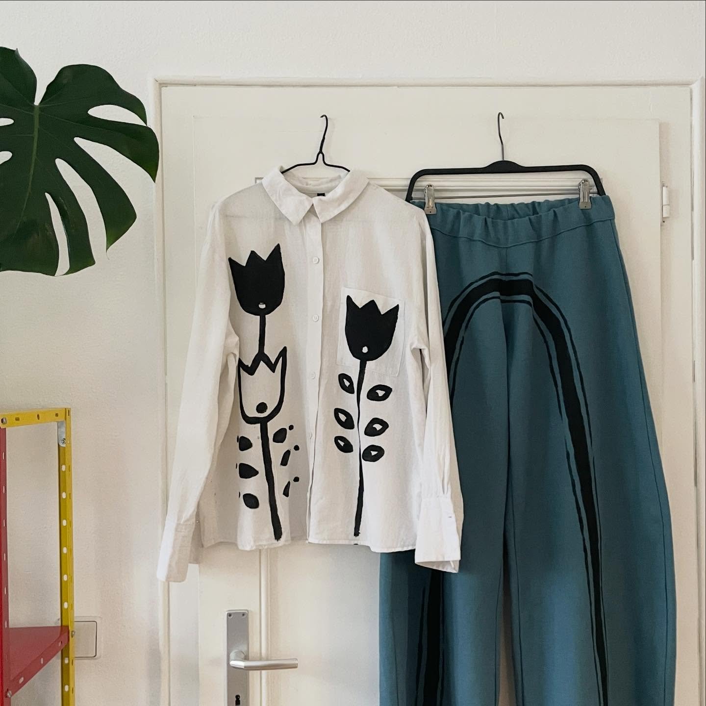 a shirt i painted on and a pair of pants i made and then painted on but they exist together nicely