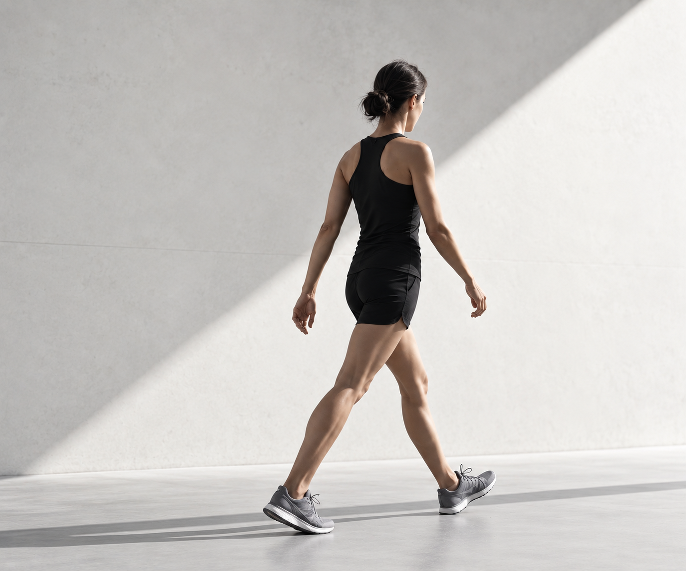A person walking in profile during a clinical movement assessment