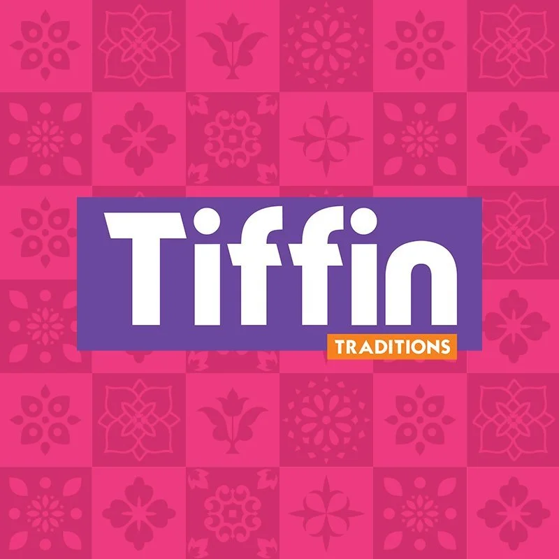 Package of Tiffin Traditions with a pink patterned background and purple logo