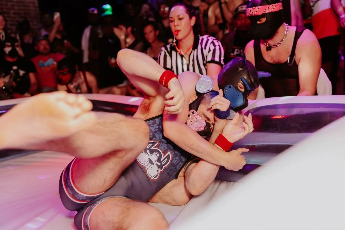 #HOWLwrapped PUP WRESTLING
August 2025 photos by @andrewjames_photo 

In the wake of a homophobic lawsuit, Precinct was down for the count. The HOWL dogs rallied together to save our doghouse and showed up in droves for our wildest idea yet: the ulti