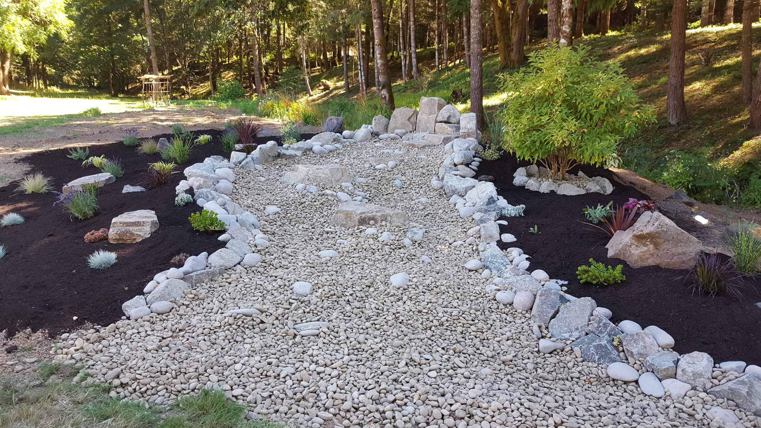 Form and function come together in this dry creek designed for year-round charm.