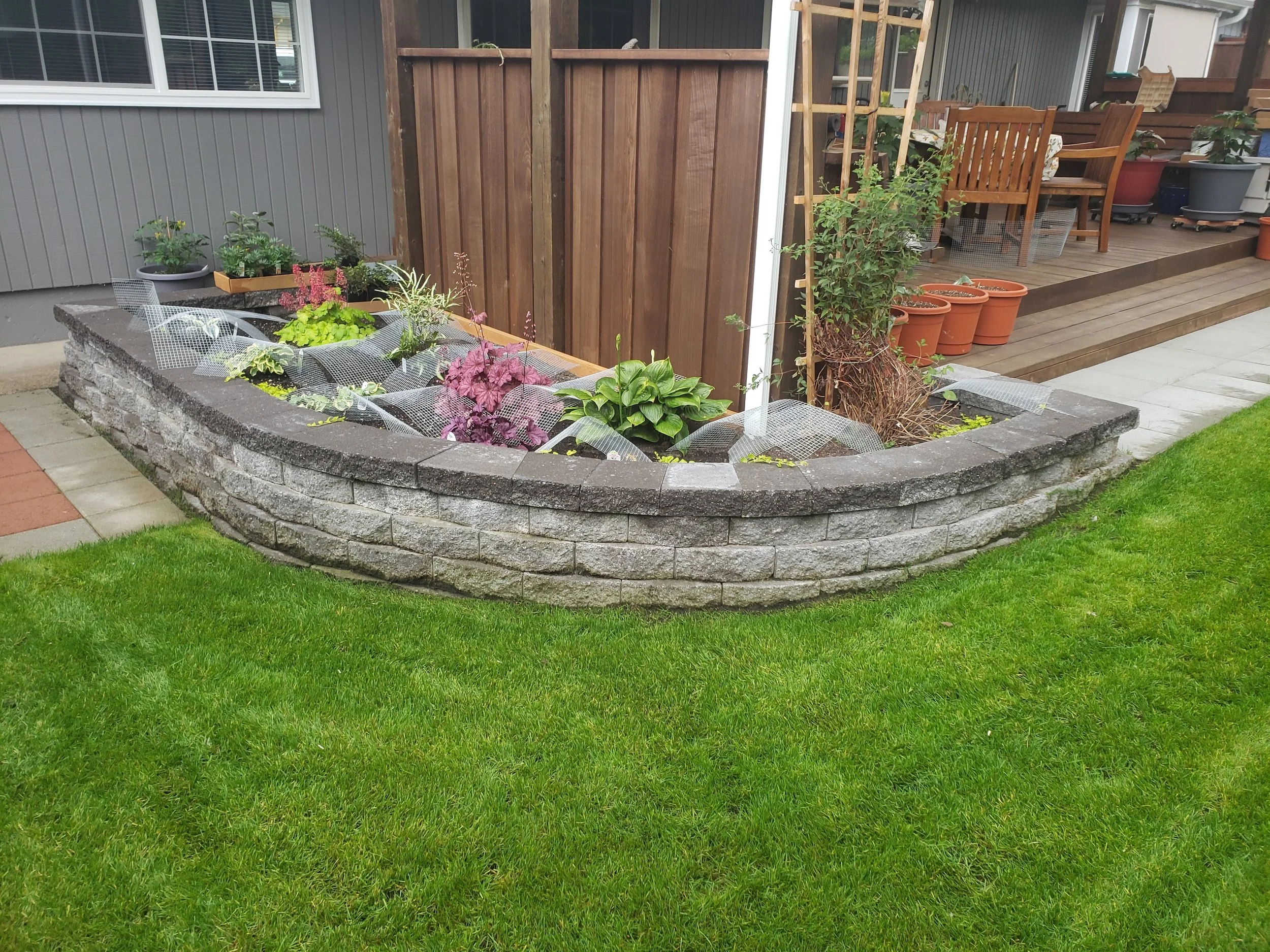 Curved stone planter wall – perfect blend of form and function for elevated garden spaces.