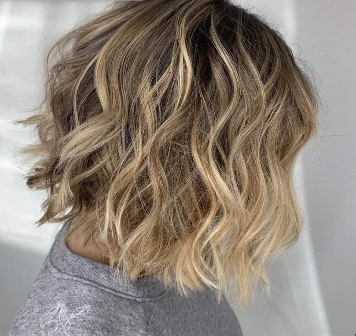 Blonde wavy bob hairstyle showing Balayages