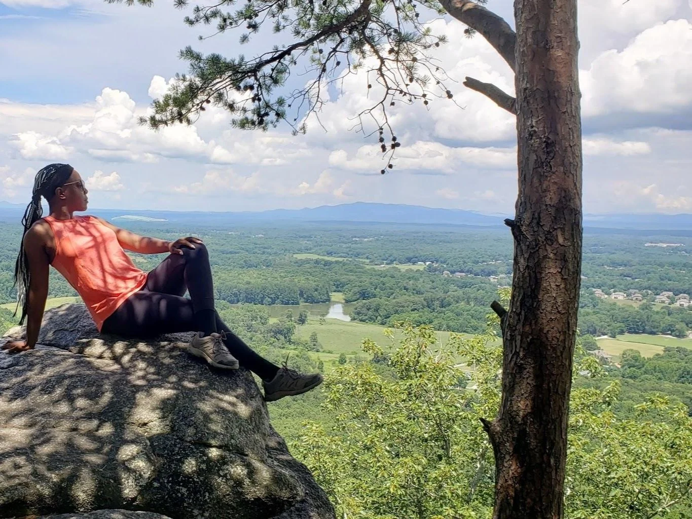 Woman enjoying a quiet moment outdoors in Georgia while practicing self care, rest, and emotional wellness.