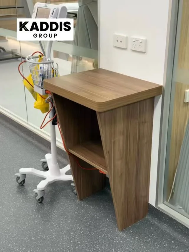 We recently completed 5 custom-built nurses’ desks designed to sit neatly outside patient rooms. Crafted in Polytec Notaio Walnut, offering both durability and a warm, natural finish. These desks were precisely shaped to follow the vinyl floor