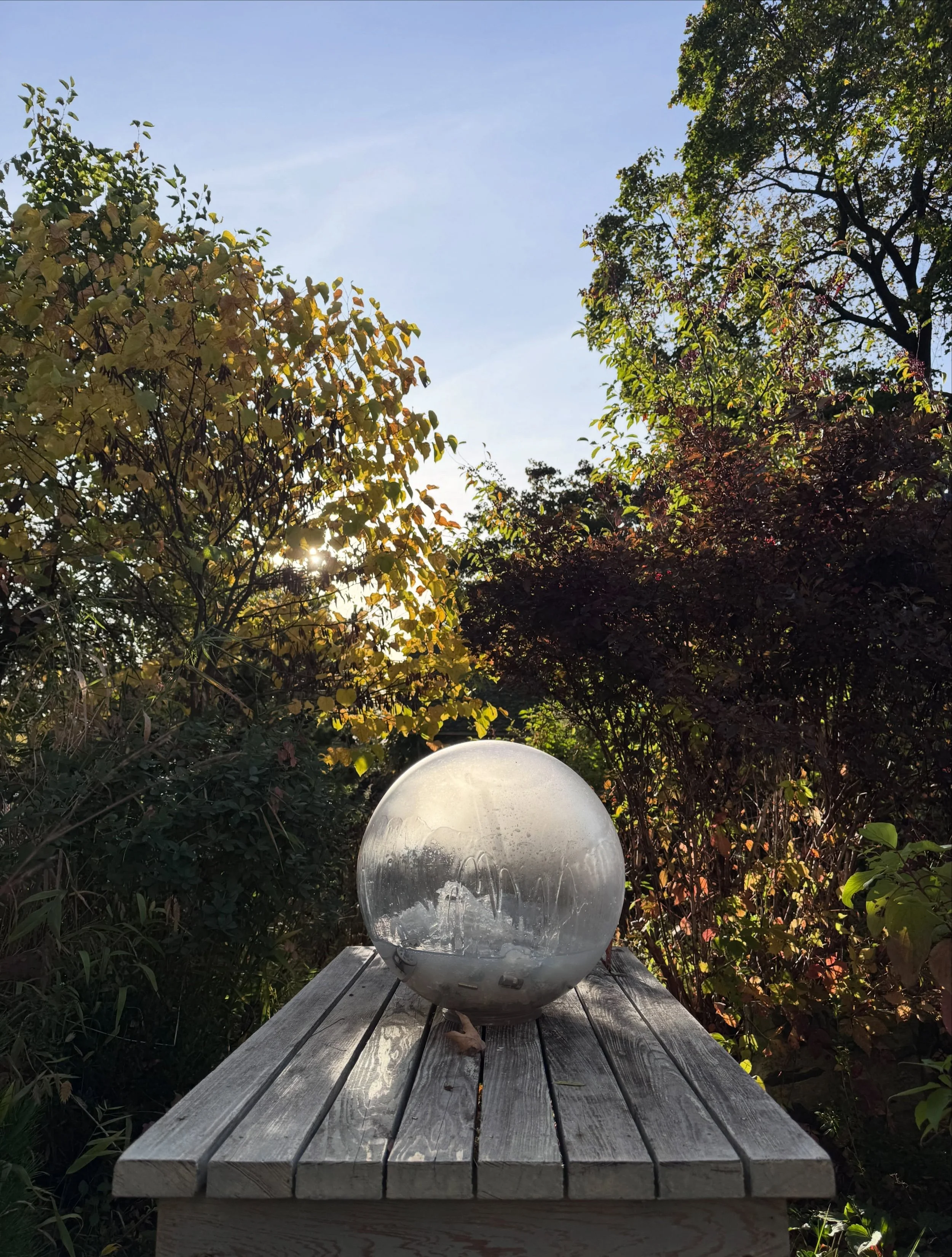 Gazing Globe in my Athens studio garden this morning, and light inside - drawings, moons 🌓