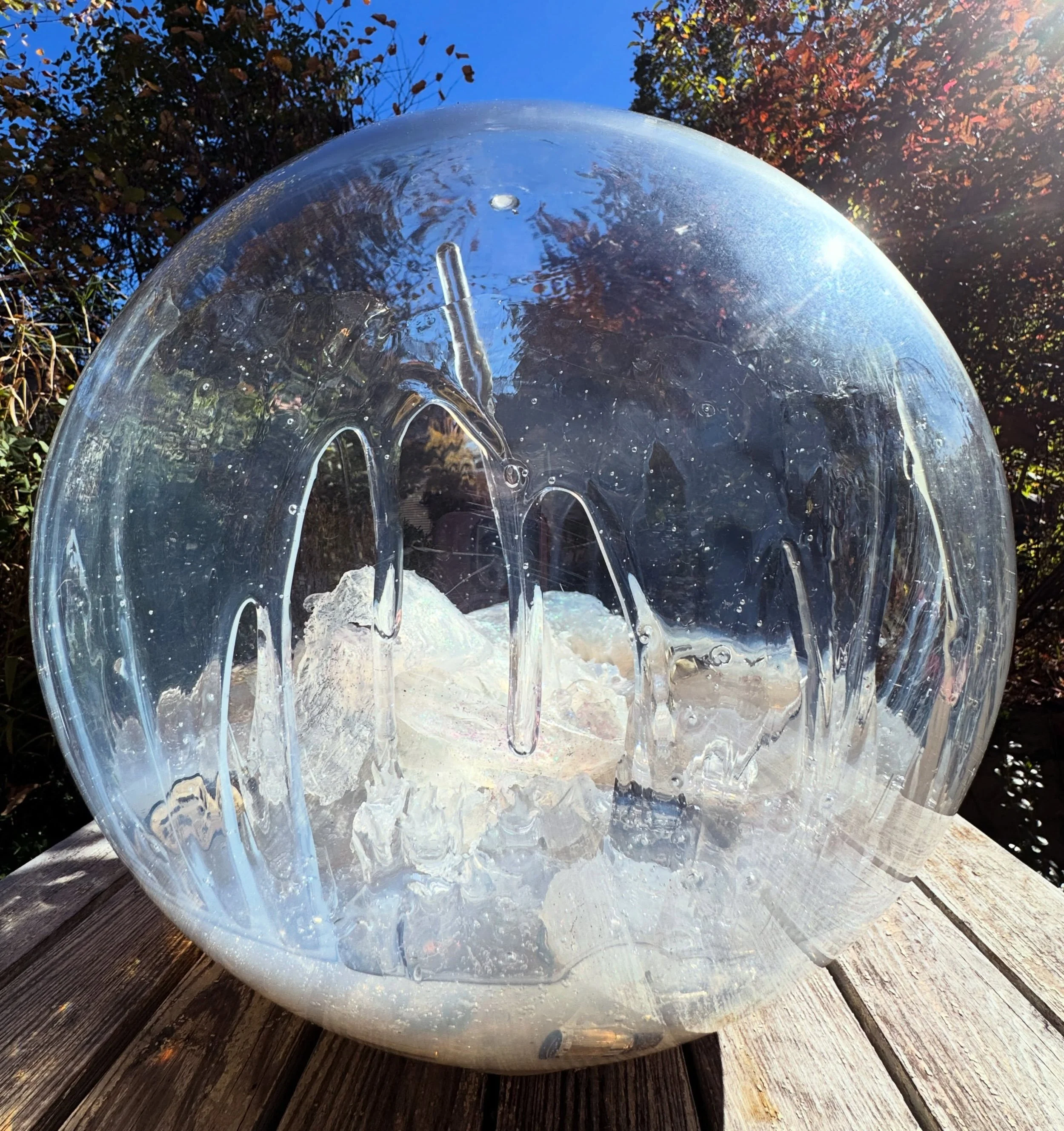 Polycarbonate, the stuff of bullet-resistant glass. Radio parts. Glitter. Industrial things that get grubby outdoors.

They get rained on, smudged, photographed, leaned on- they reflect whoever comes close.

www.paulahayes.com