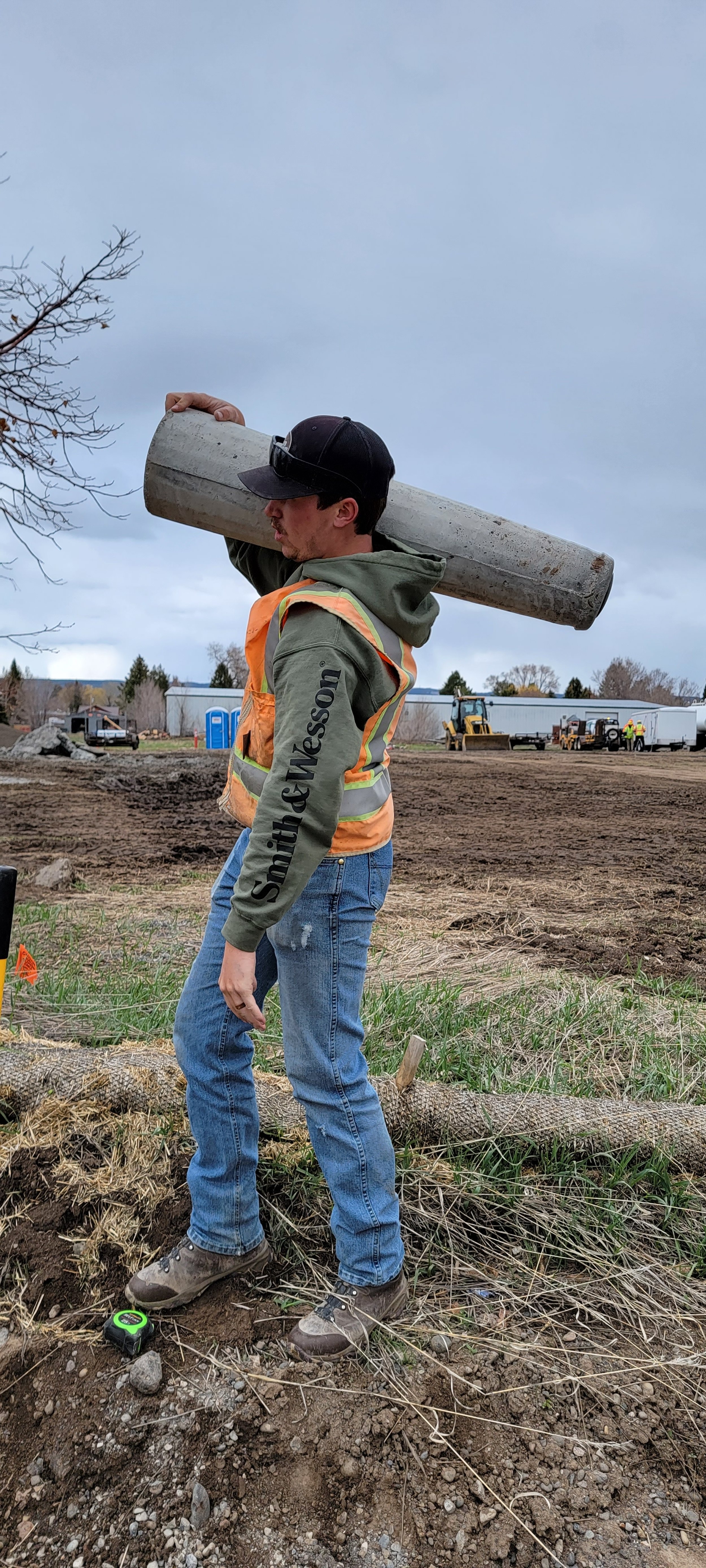 An employee hauling equipment on the jobsite.