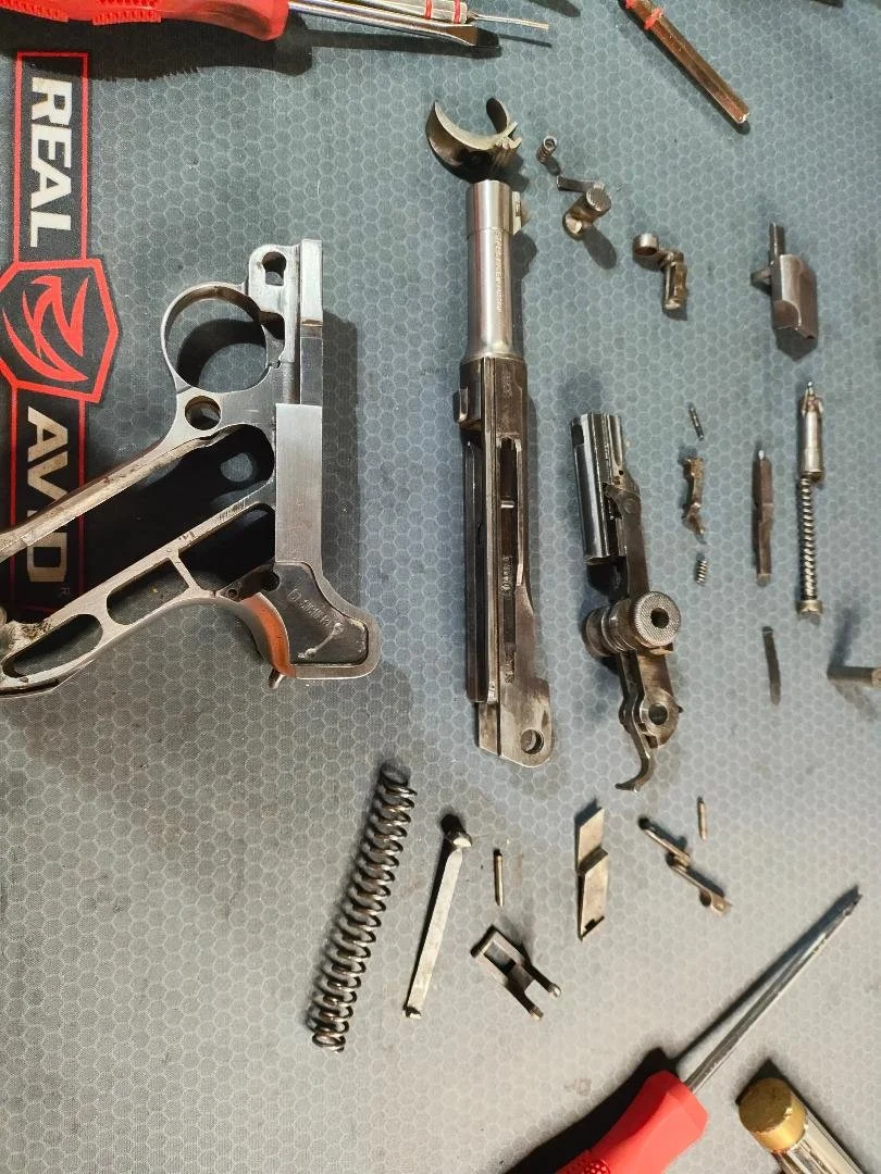 Fully disassembled and cleaned Luger P08 (0.9mm).