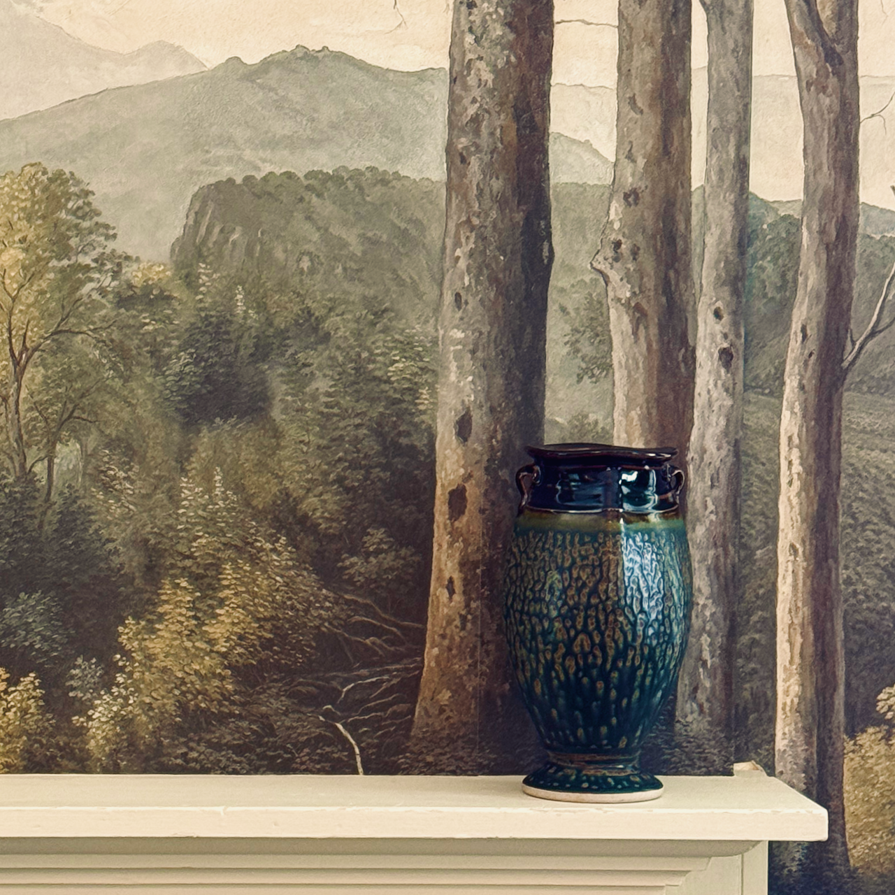 Artisan vase on mantel in a quiet interior