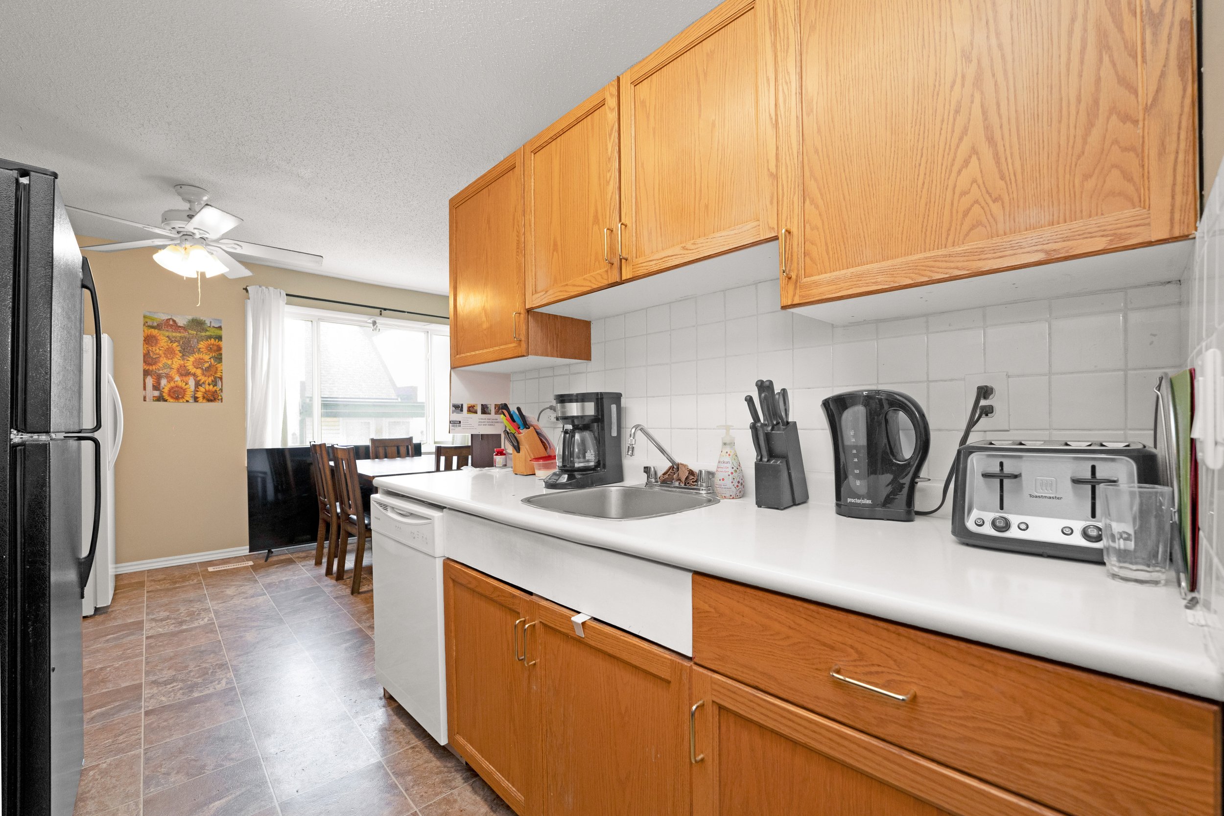 Bright kitchen area with clean countertops and modern appliances.
