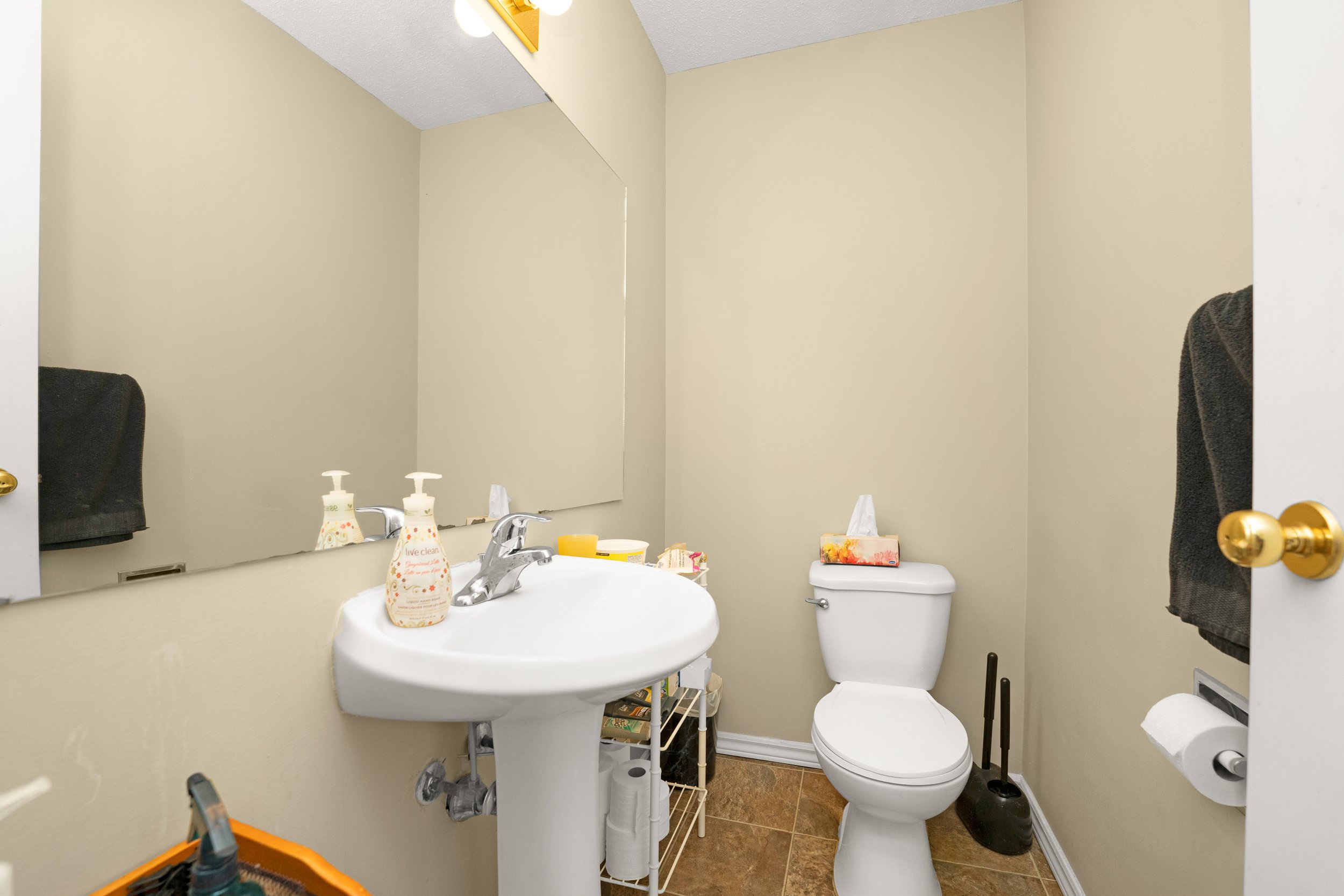 Clean bathroom in a home with a sink and toilet.