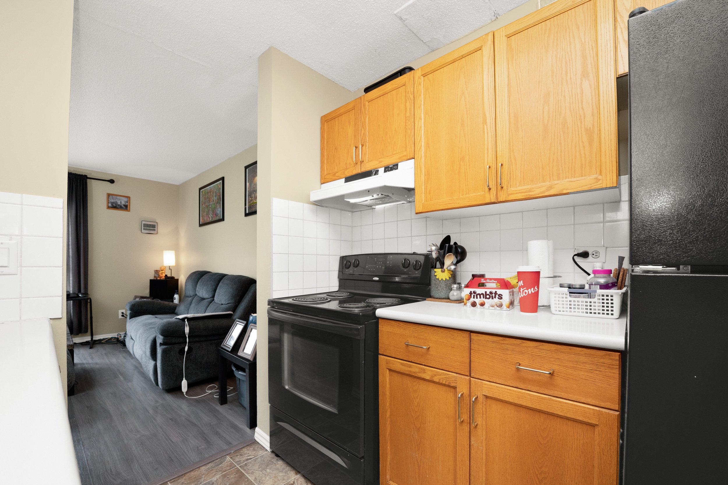 Functional kitchen featuring a sink and storage cabinets.