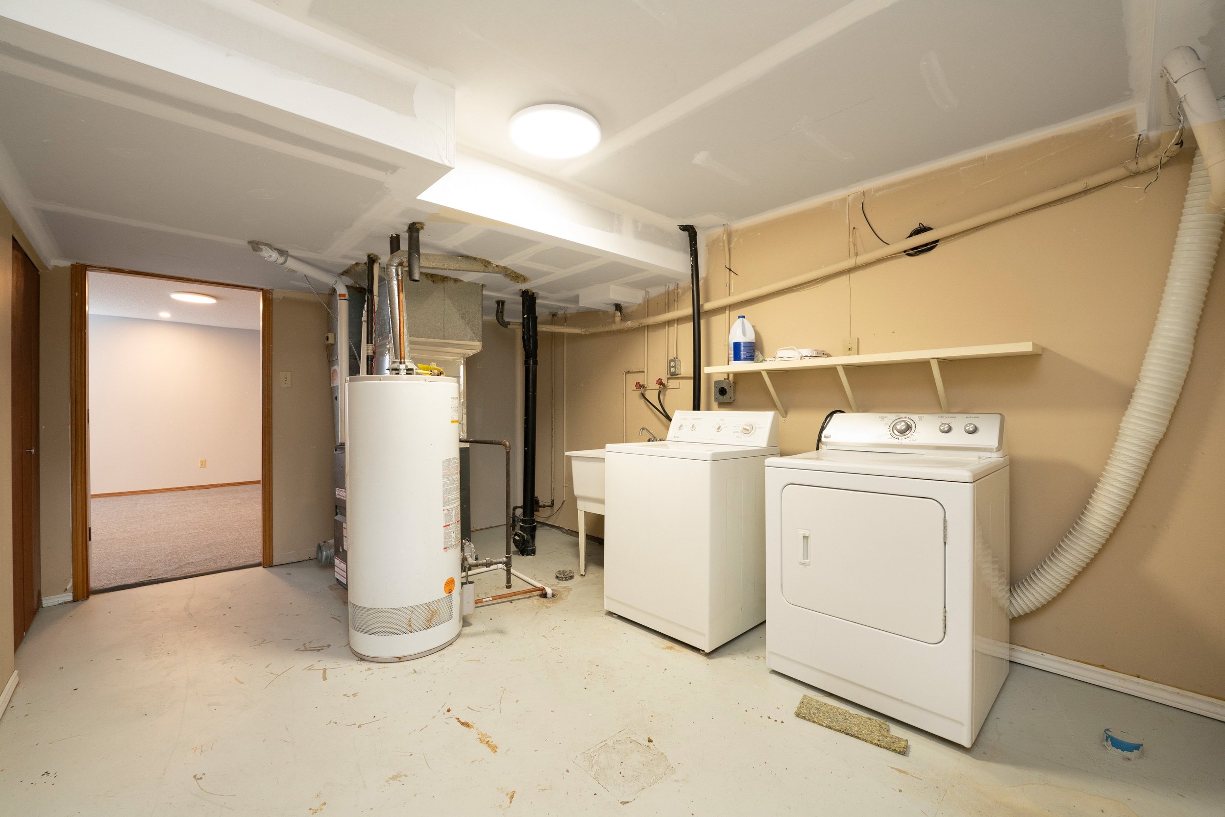Modern laundry room in a rent to own home with washer and dryer, ideal for family living.