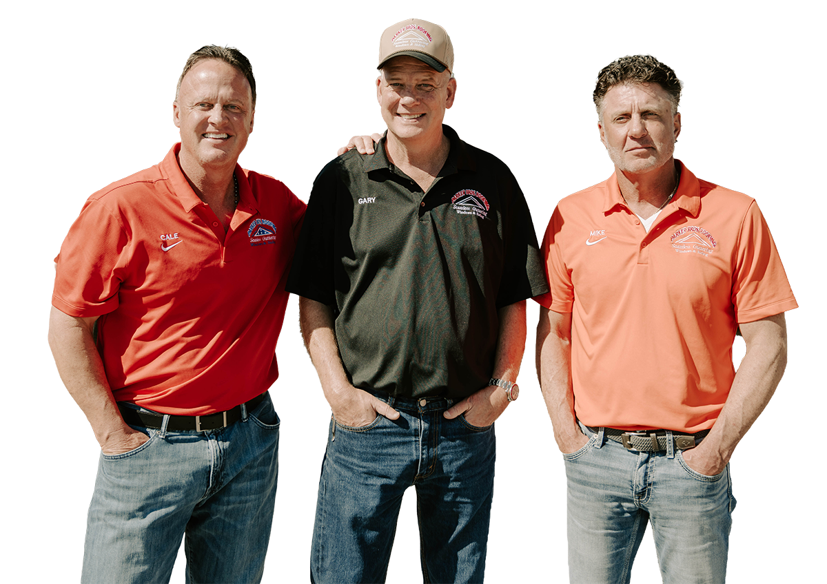 Three men wearing casual polo shirts and jeans pose together for a photo.
