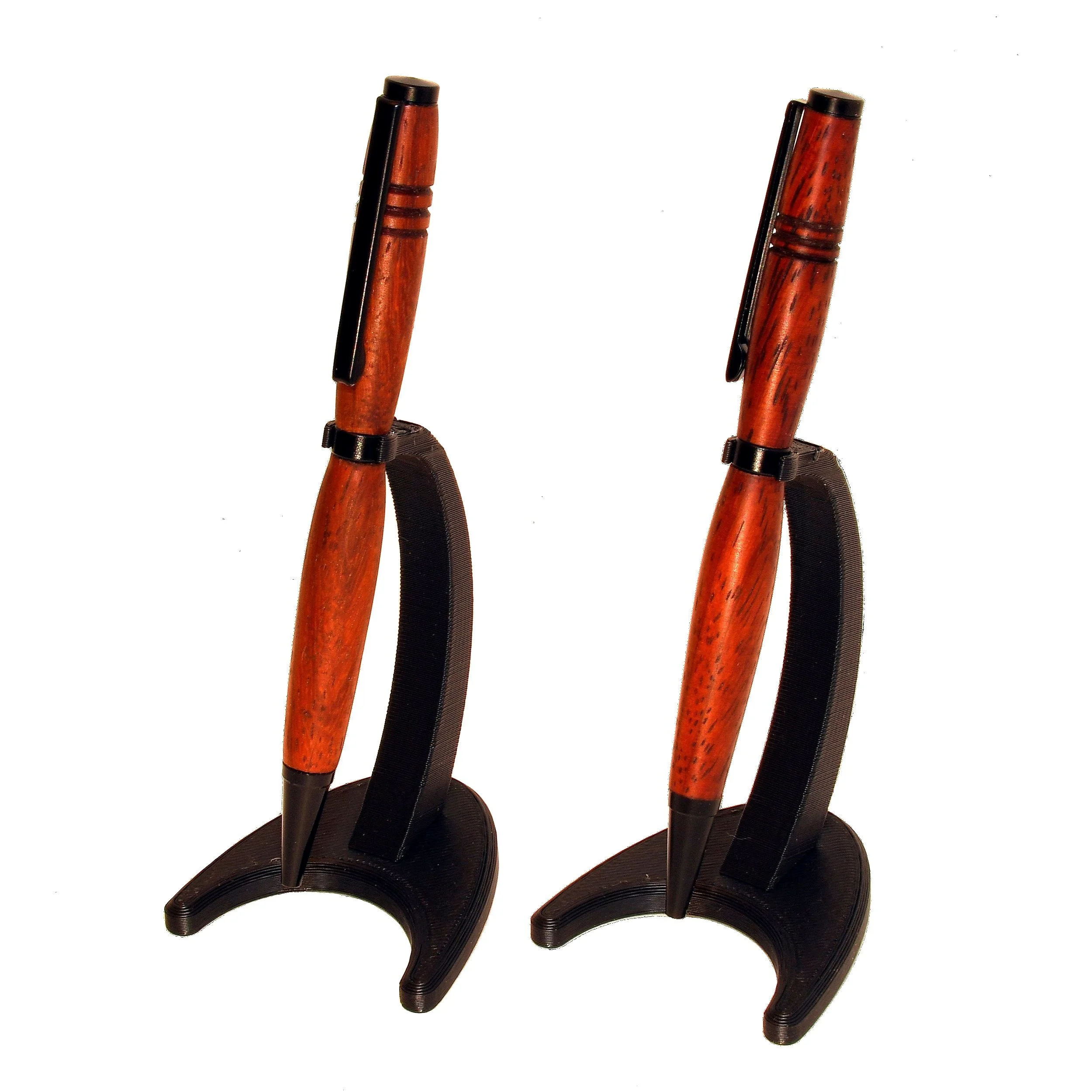 Padauk and Matte Black Pens on black pen stands