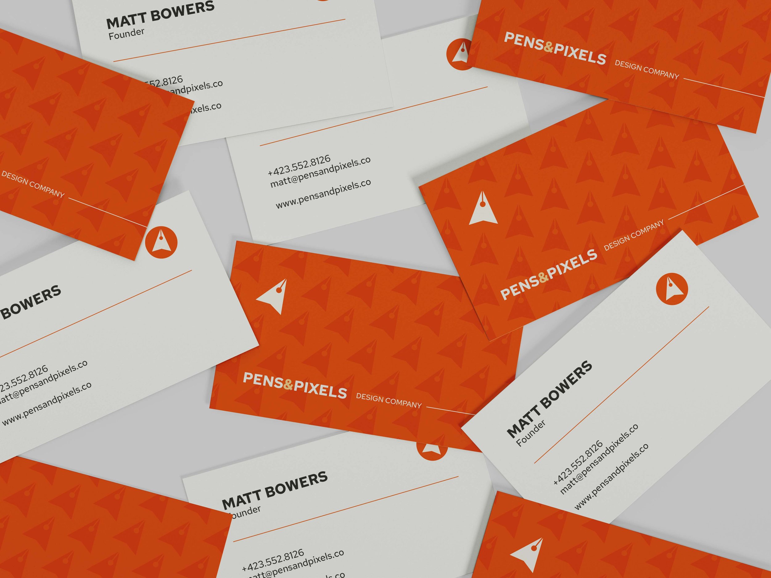 Assorted business cards with "Pens & Pixels Design Company" branding, featuring a red and white color scheme, contact information, and a stylized logo.