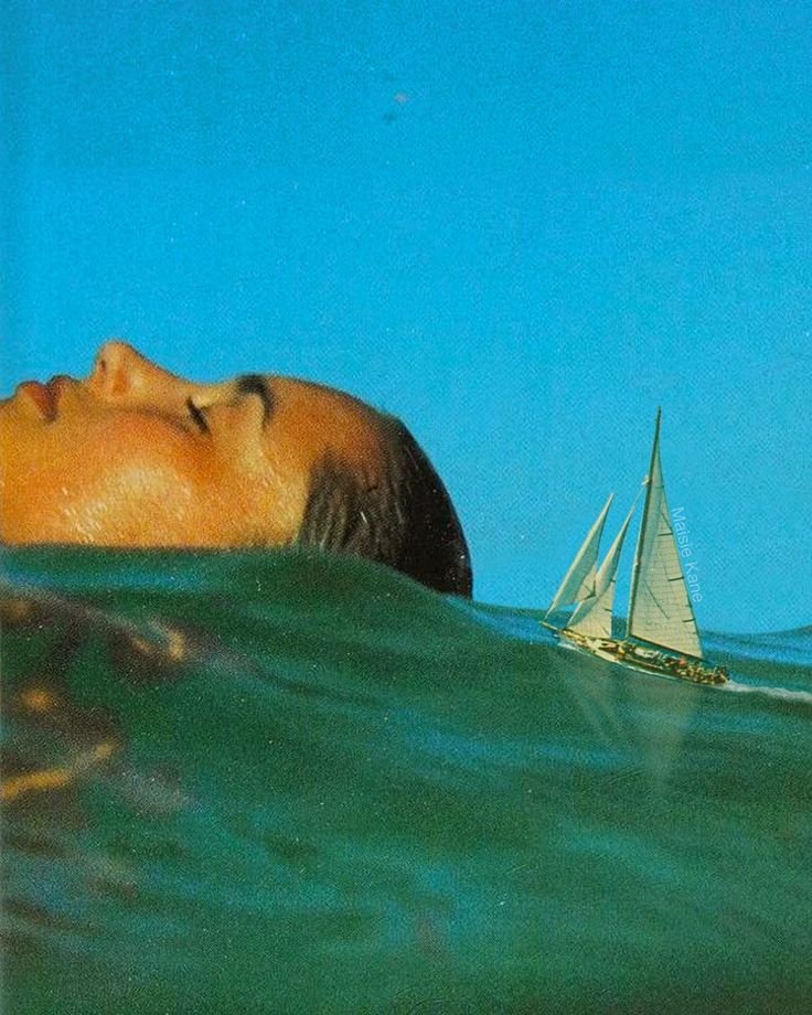 Surreal image of a face partially submerged in water with a sailboat nearby.