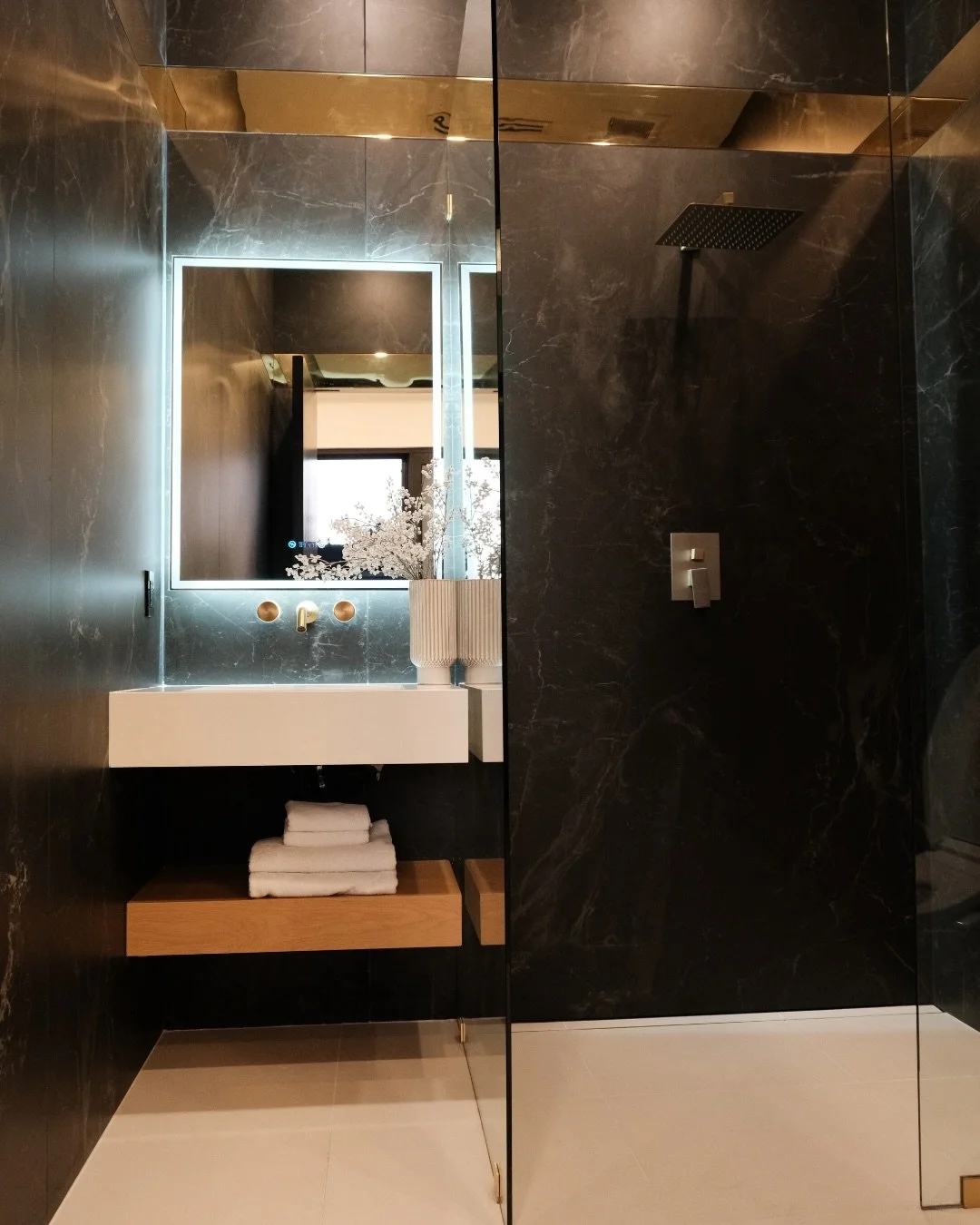 Let your lighting steal the spotlight. 💡 

From backlit stone to illuminated mirrors, creativity shines brightest in the details.

#TABuilders #LuxuryConstruction #DreamHome #LightingDesign #CustomLiving