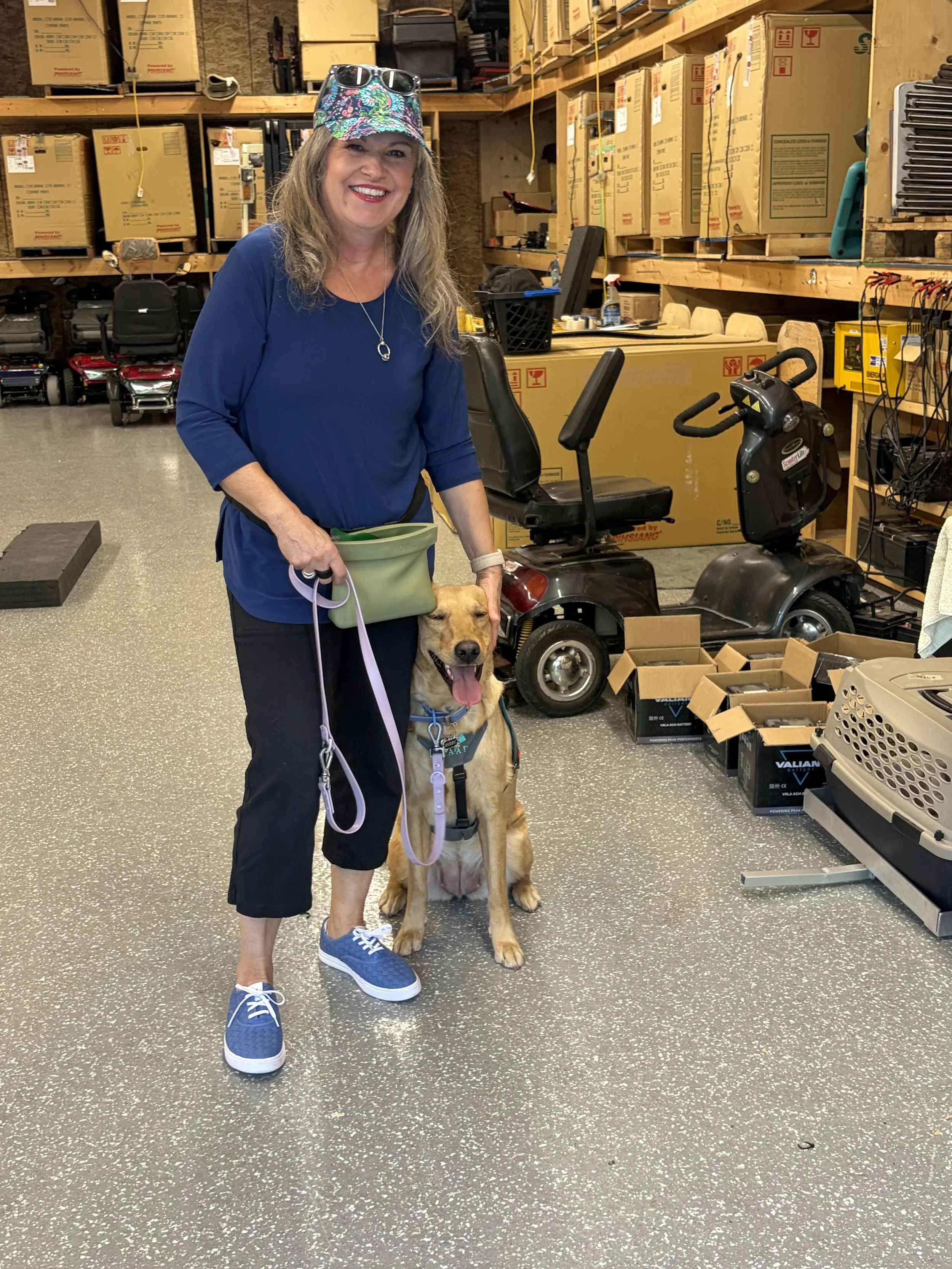 IAAD assistance dog with handler practicing skills in a public indoor environment.