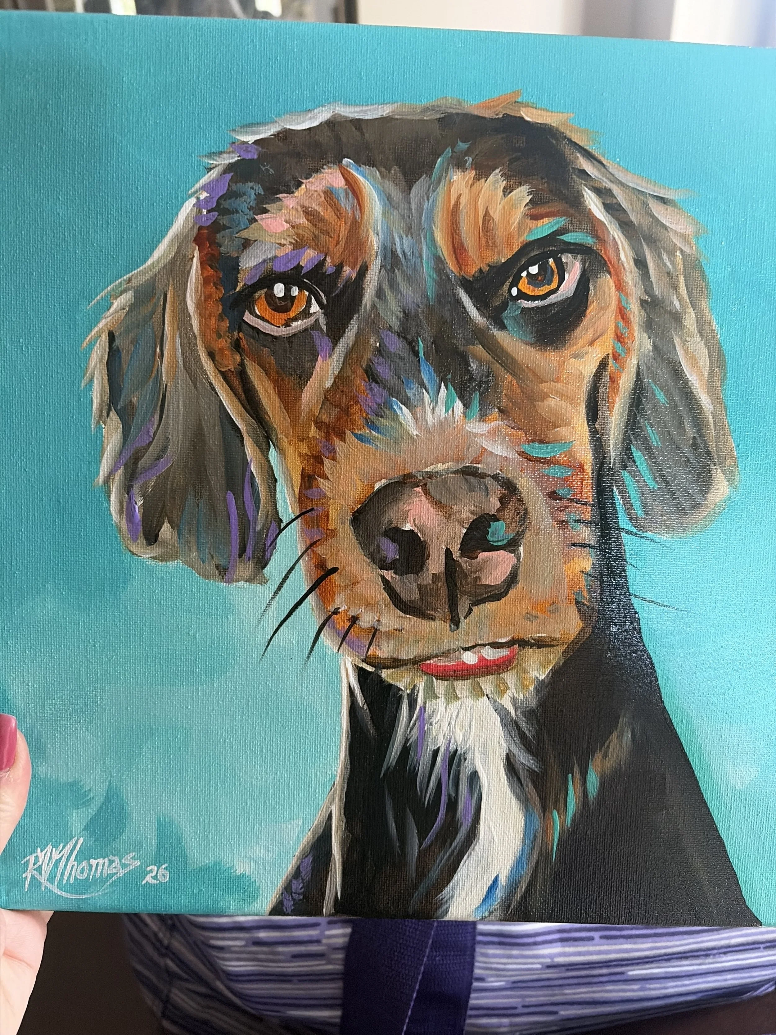 Colourful dog portrait created during an IAAD community fundraising event.