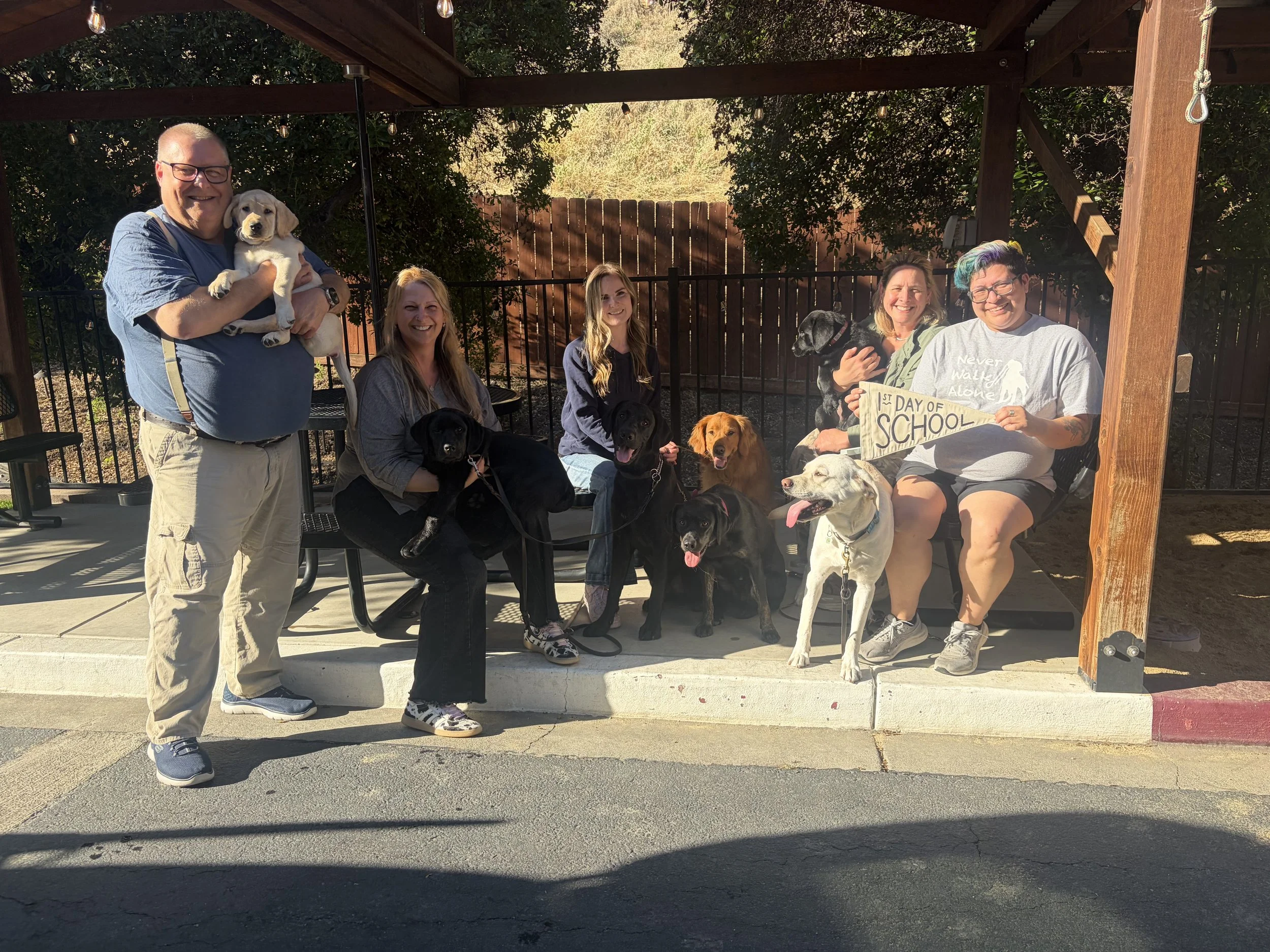 IAAD assistance dogs, puppies, handlers, and volunteers gathered for the first day of training.