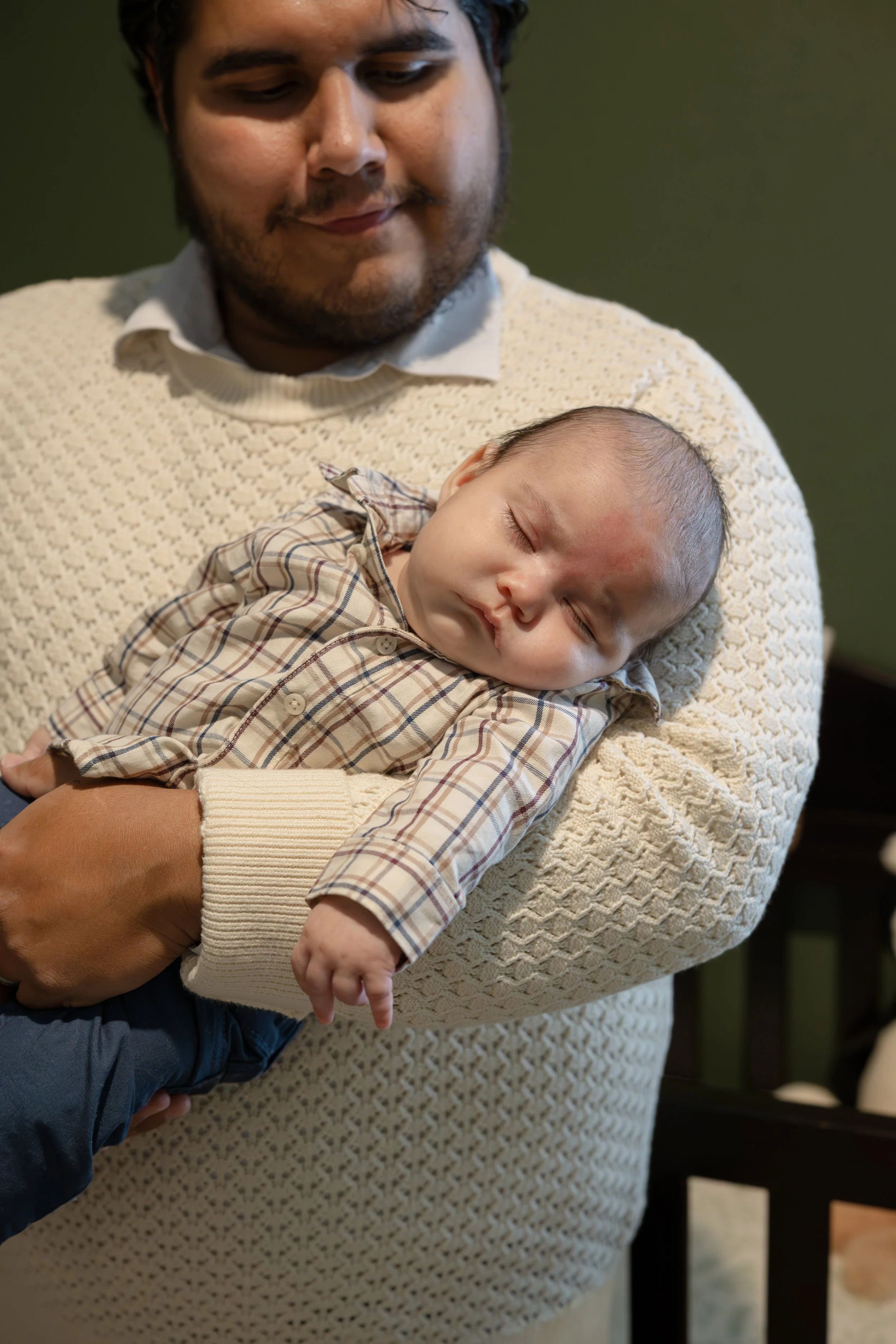 houston-dad-holding-newborn-sleeping.jpg
