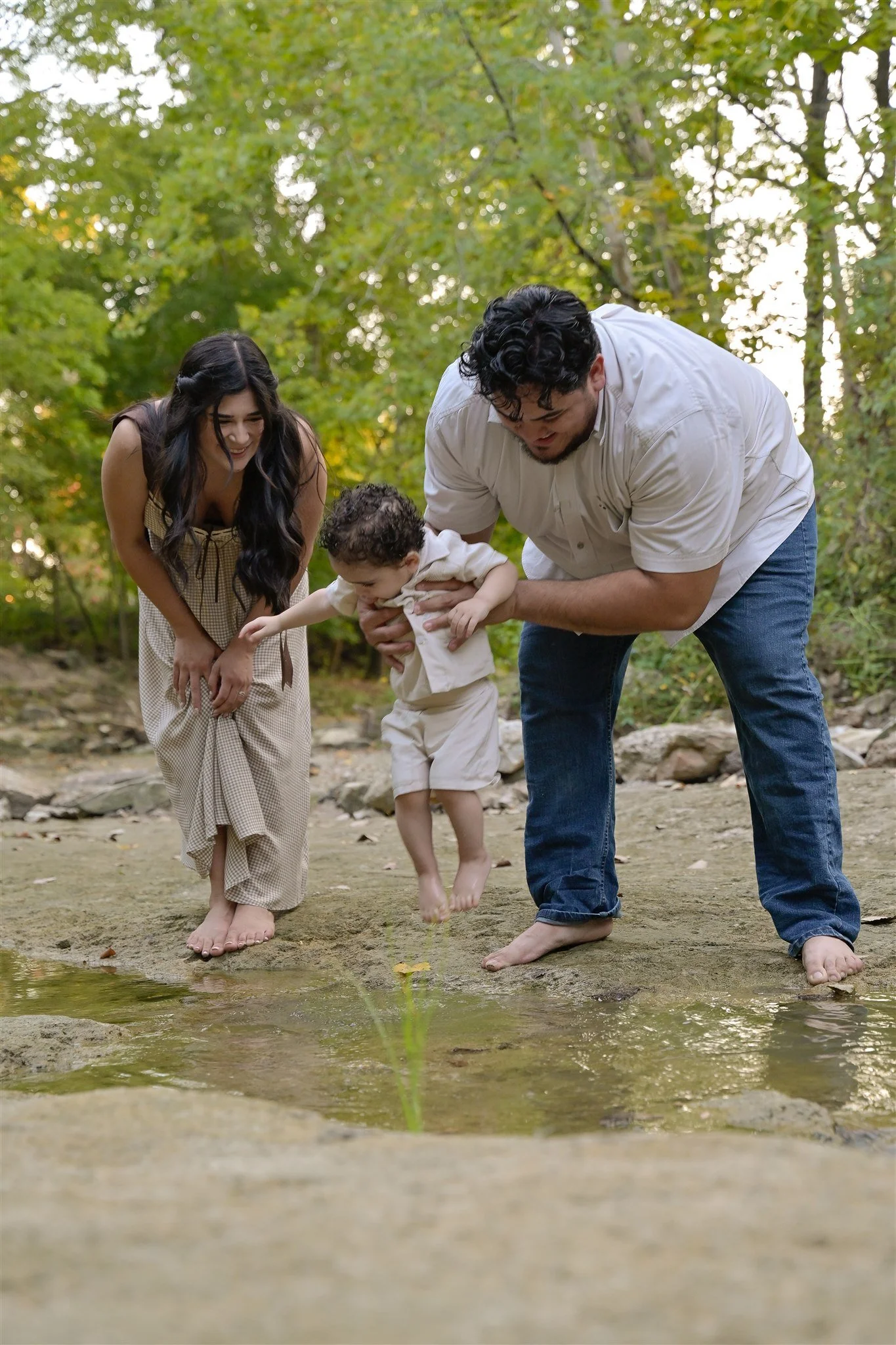 houston family engaged in play in nature smiling