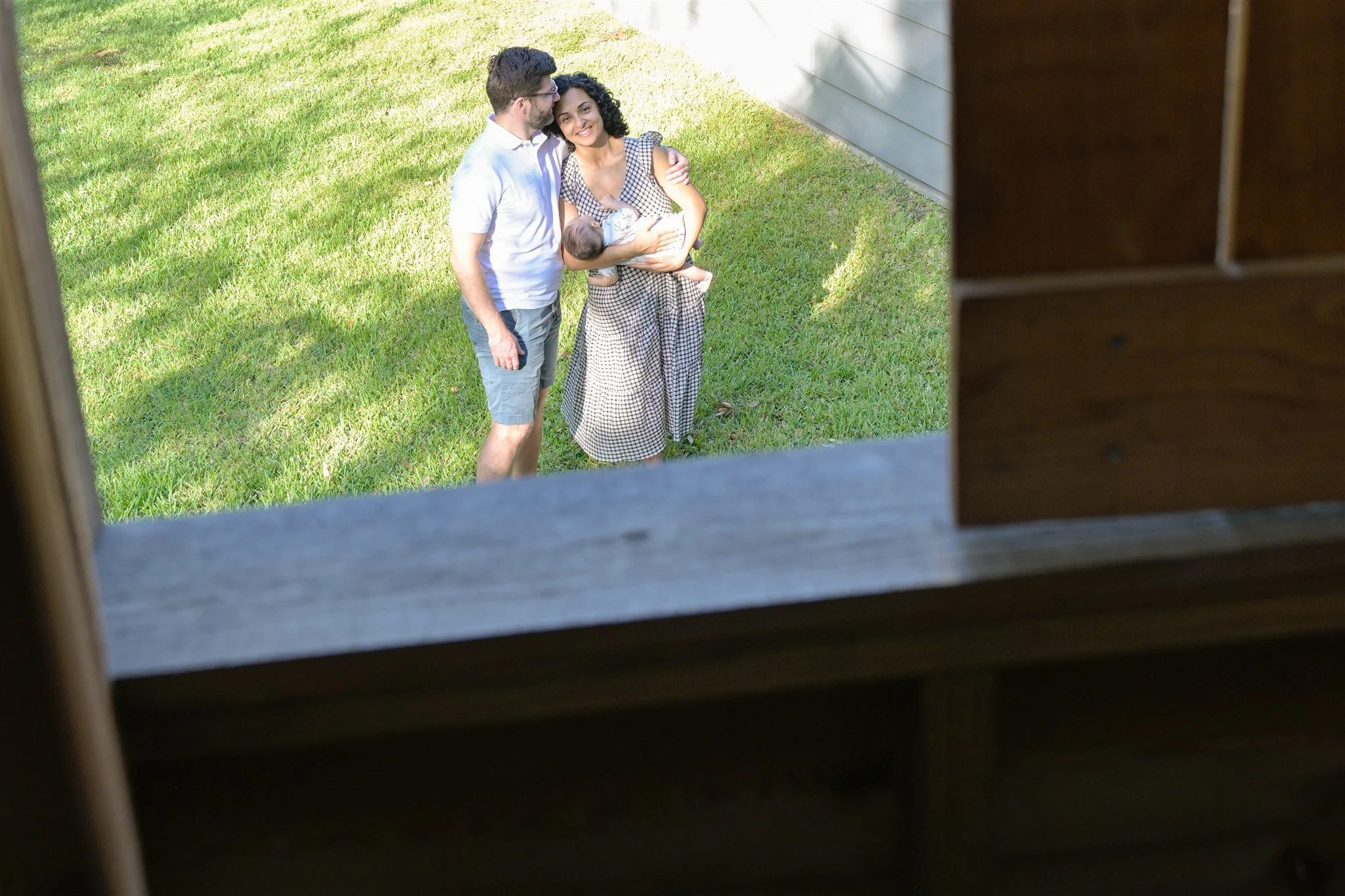 houston couple family holding newborn smiling in nature