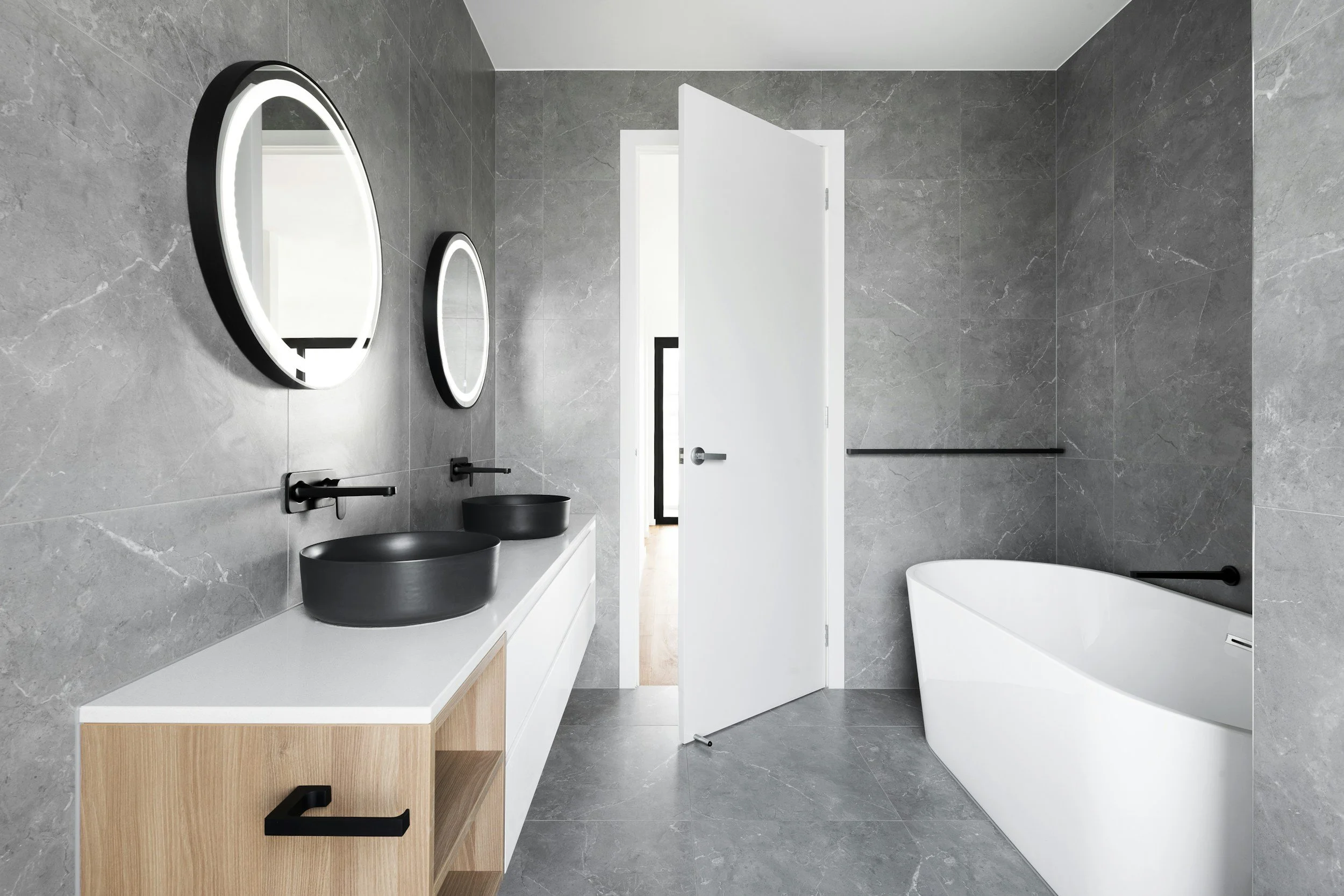 Contemporary bathroom renovation with freestanding tub by Fascon Renovations Sydney