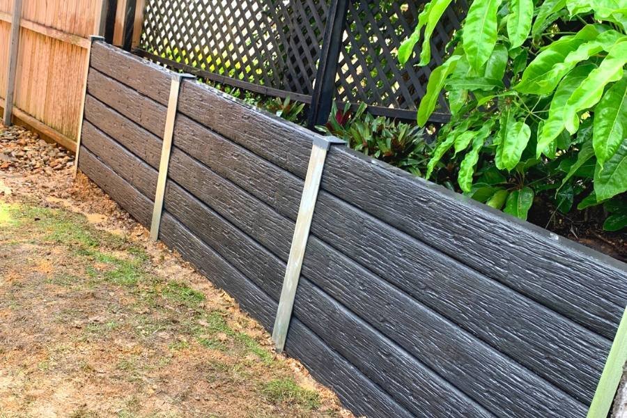 Feature concrete sleeper retaining wall with textured finish built in Sydney